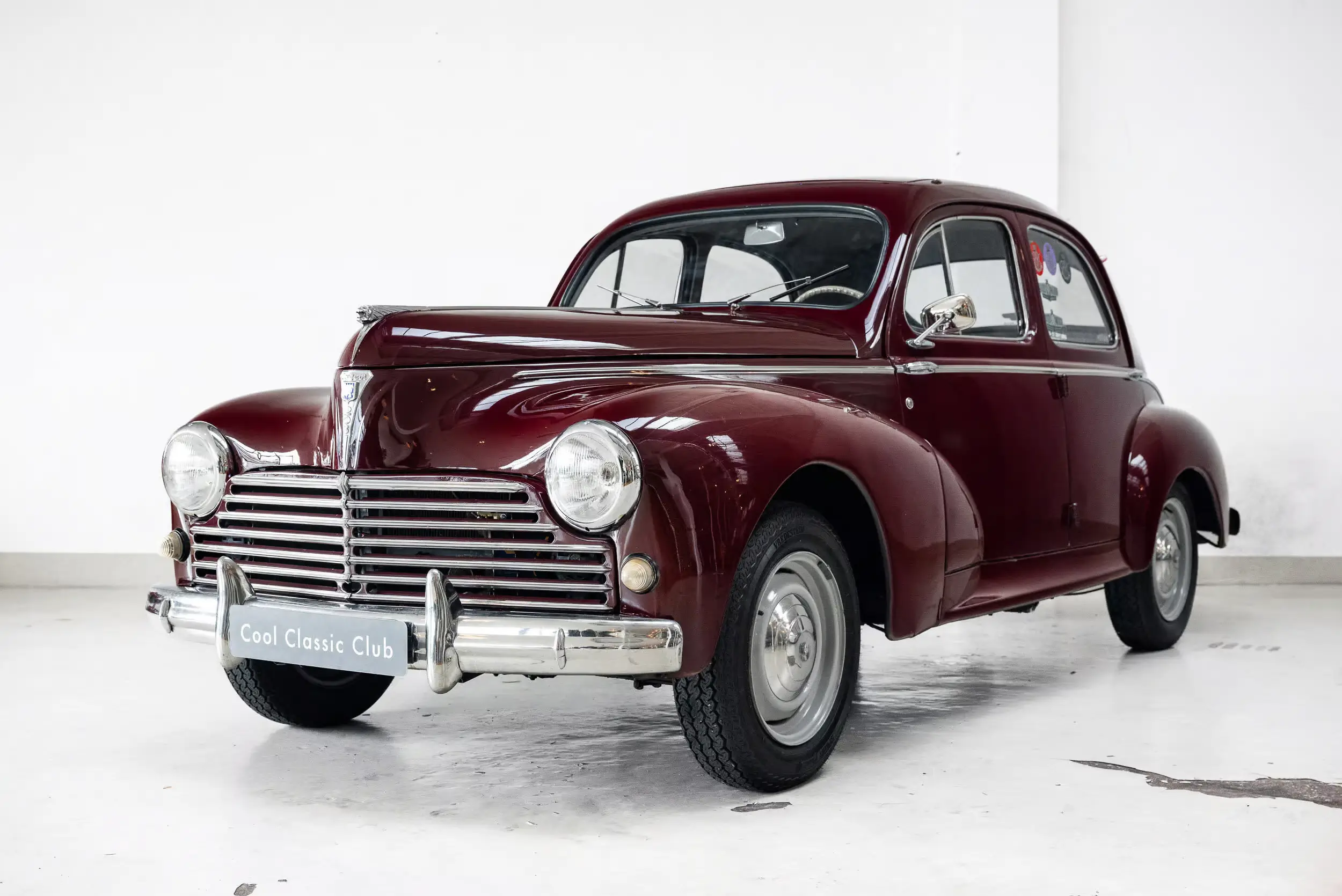 Front oblique view of the 1954 Bordeaux Red Peugeot 203