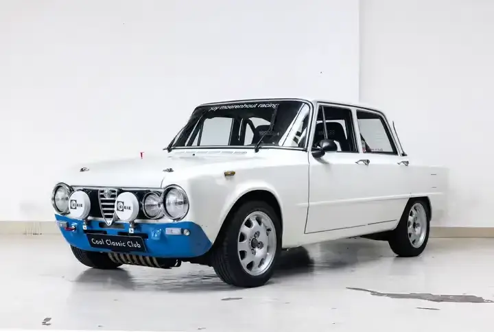 Front oblique view of the 1975 White Alfa Romeo Giulia 1300 Super 