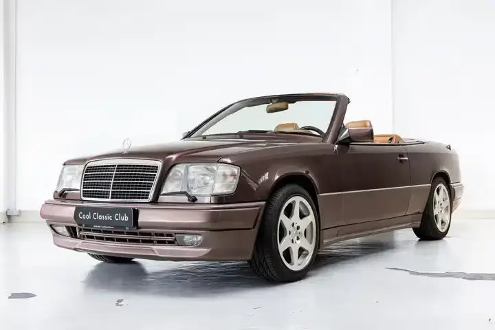 Front oblique view of the 1997 Nutria metallic Mercedes-Benz E220 AMG Cabriolet