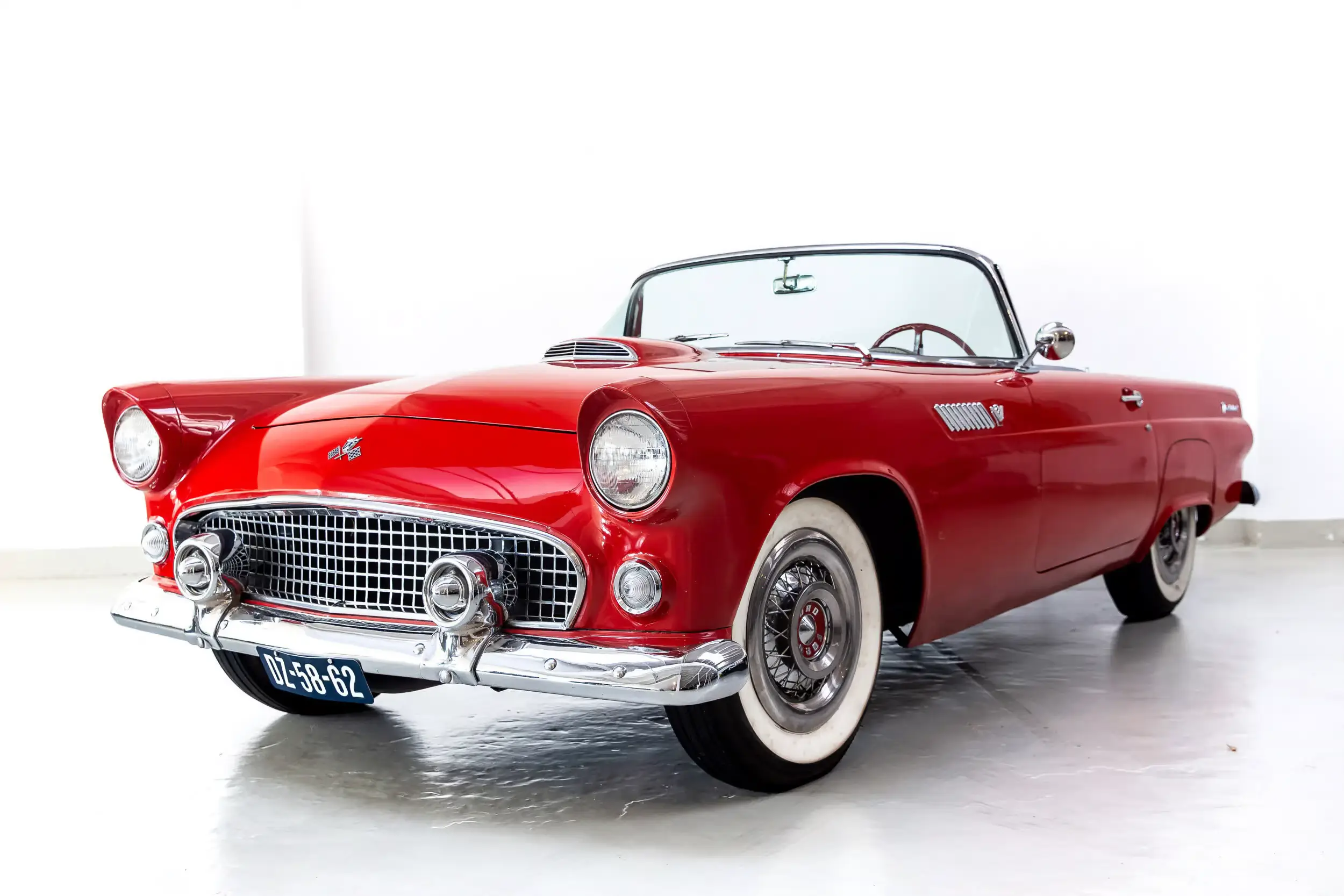 Front oblique view of the 1955 Torch Red Ford Thunderbird