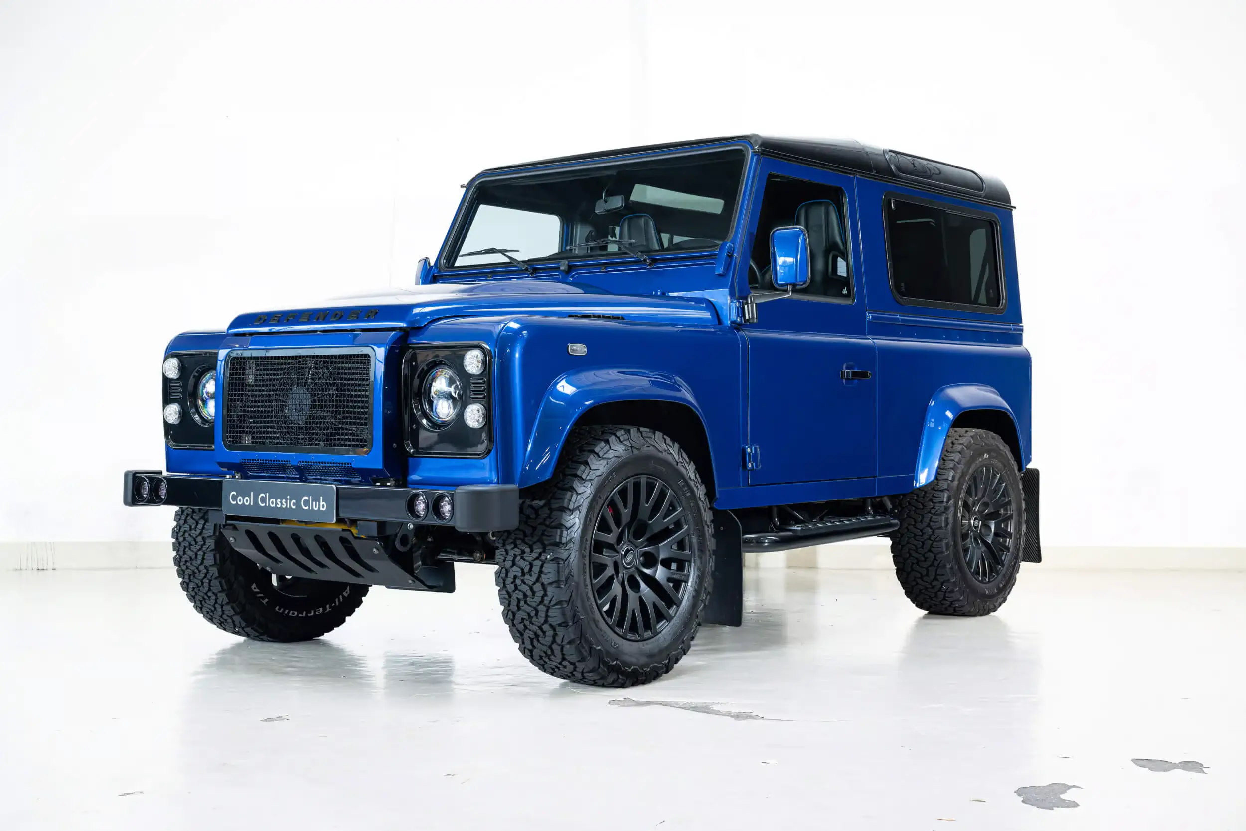 Front oblique view of the 1988 Velocity Blue Land Rover Defender 90 Urban