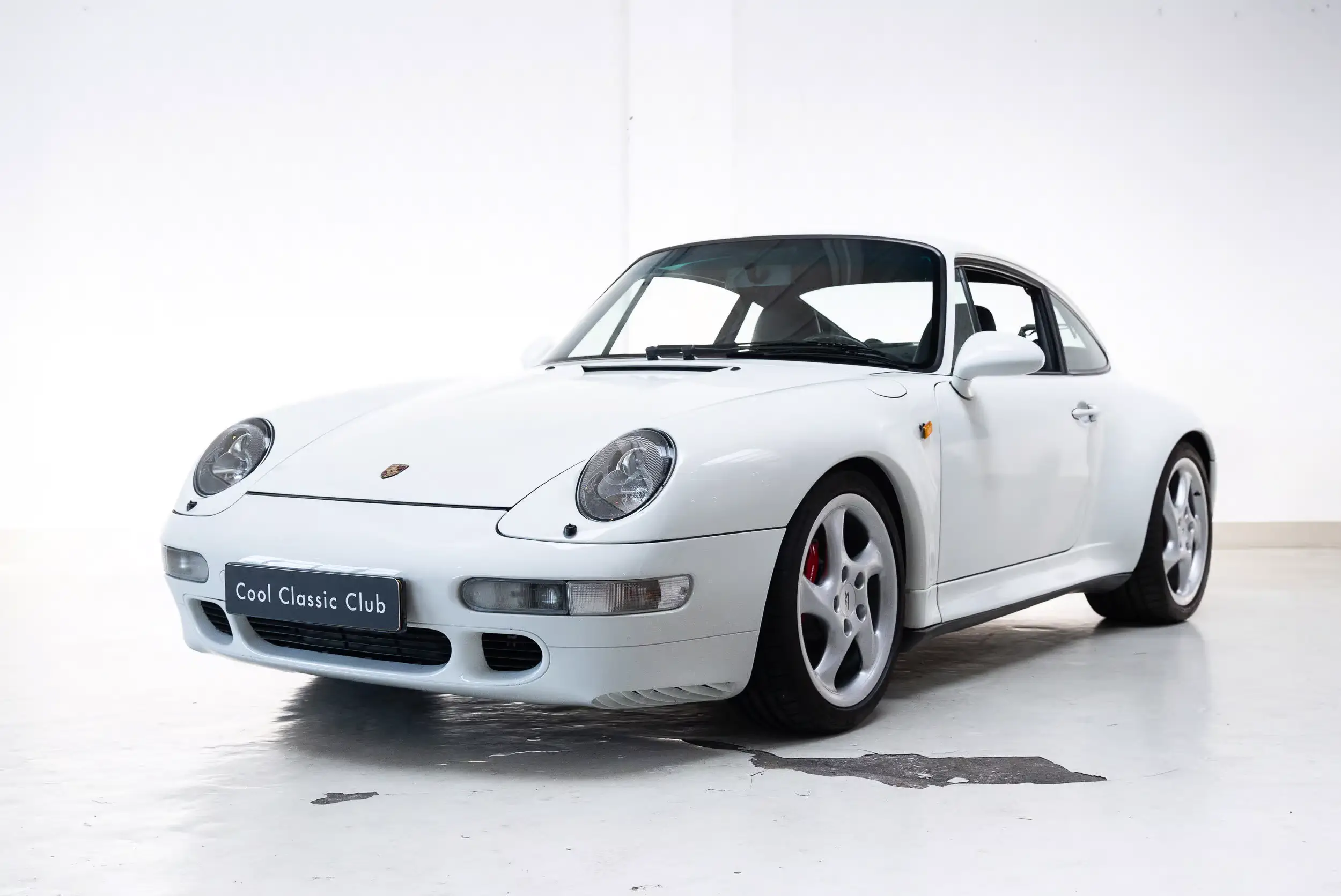 Front oblique view of the 1996 Grand Prix White Porsche 993 4S