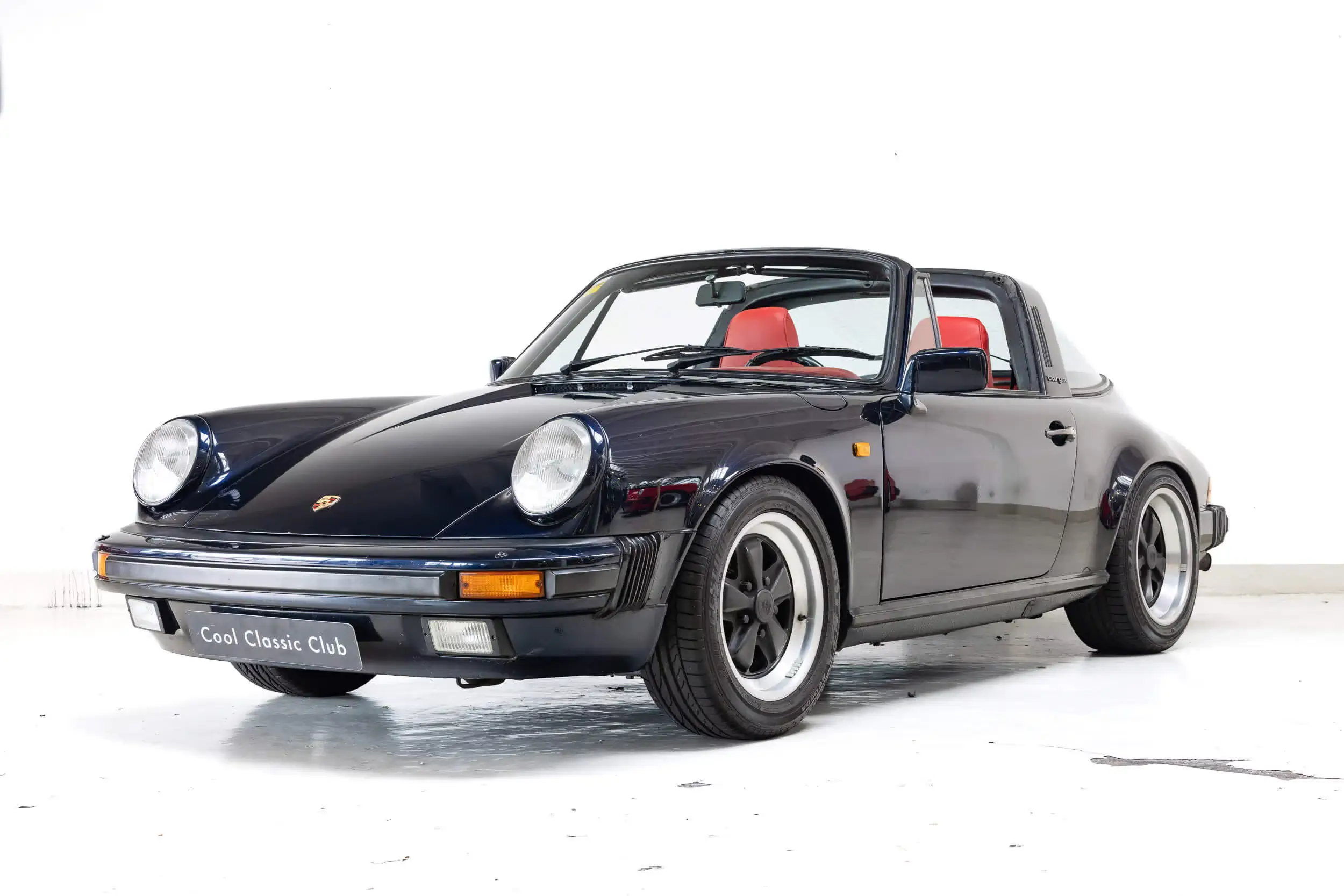 Front oblique view of the 1985 Midnight Blue Metallic Porsche 911 Carrera 3.2 Targa