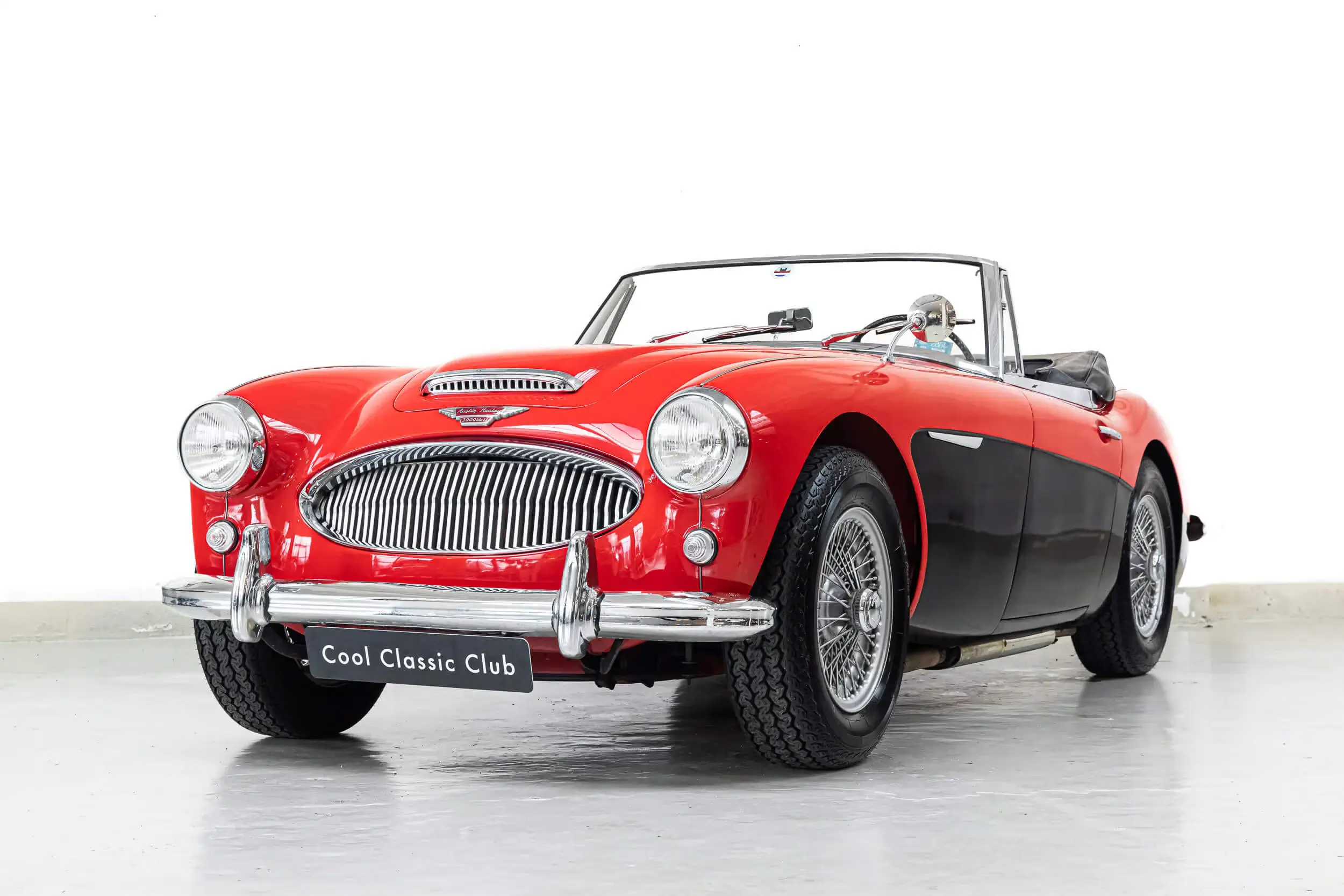 Front oblique view of the 1964 Two Tone: Colorado Red & Black Austin Healey 3000 MKII