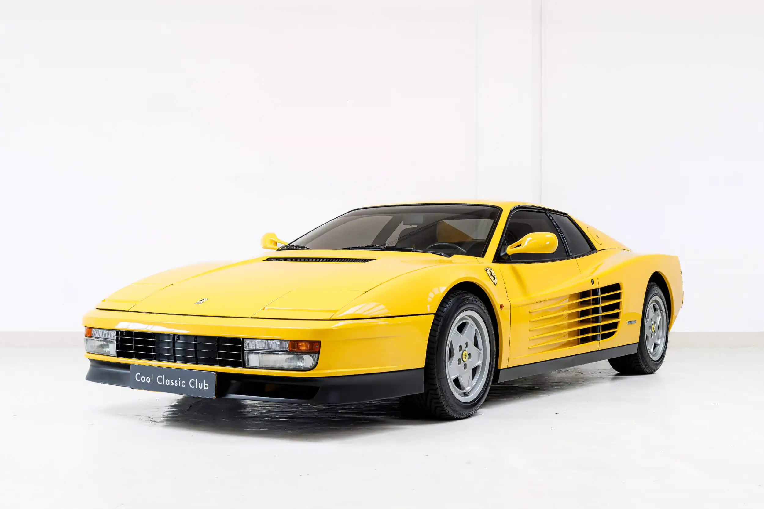 Front oblique view of the 1989 Giallo Fer 102 Ferrari Testarossa