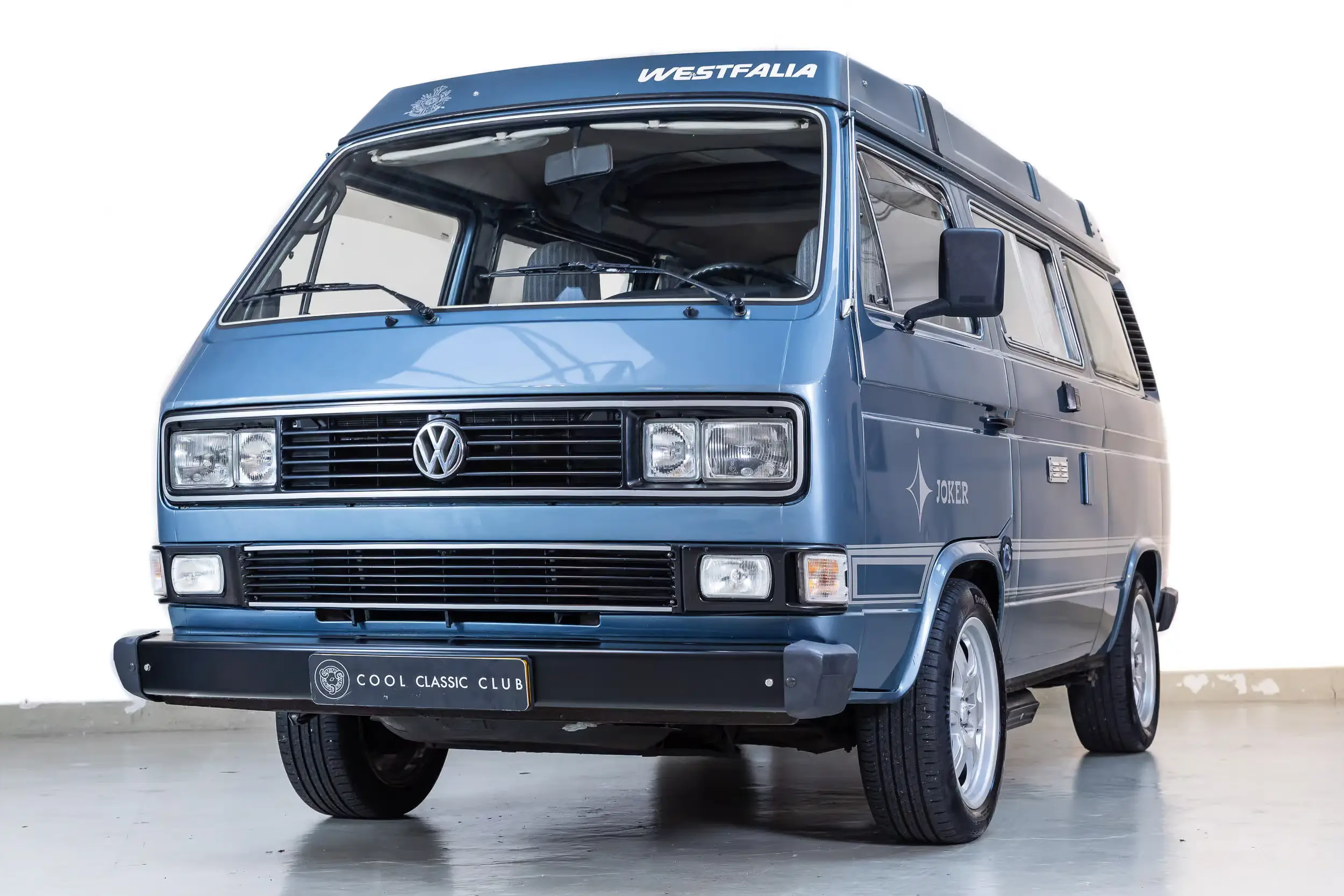 Front oblique view of the 1983 Blue Volkswagen T3 Westfalia Joker