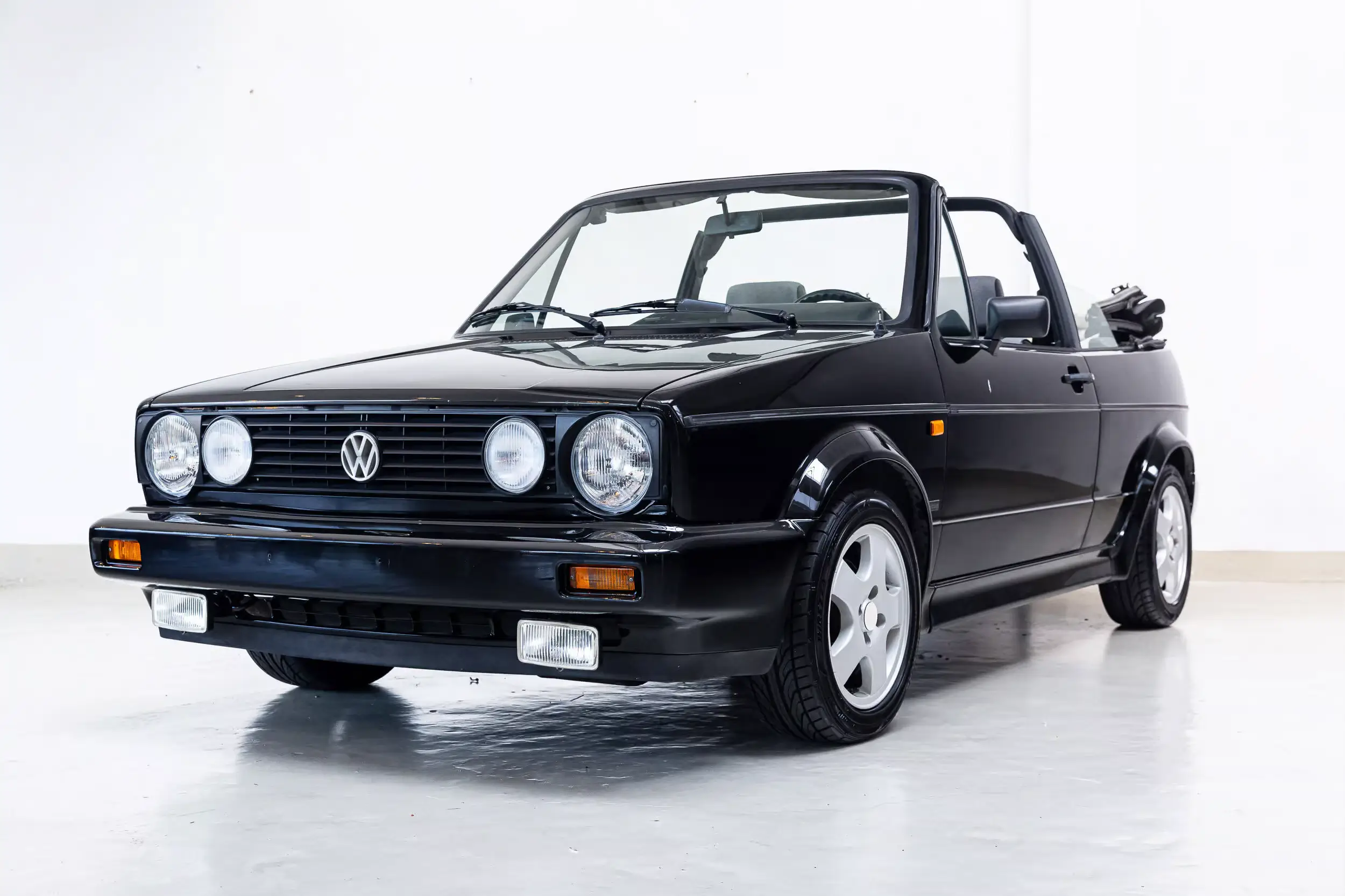 Front oblique view of the 1991 Black Volkswagen Golf Cabriolet