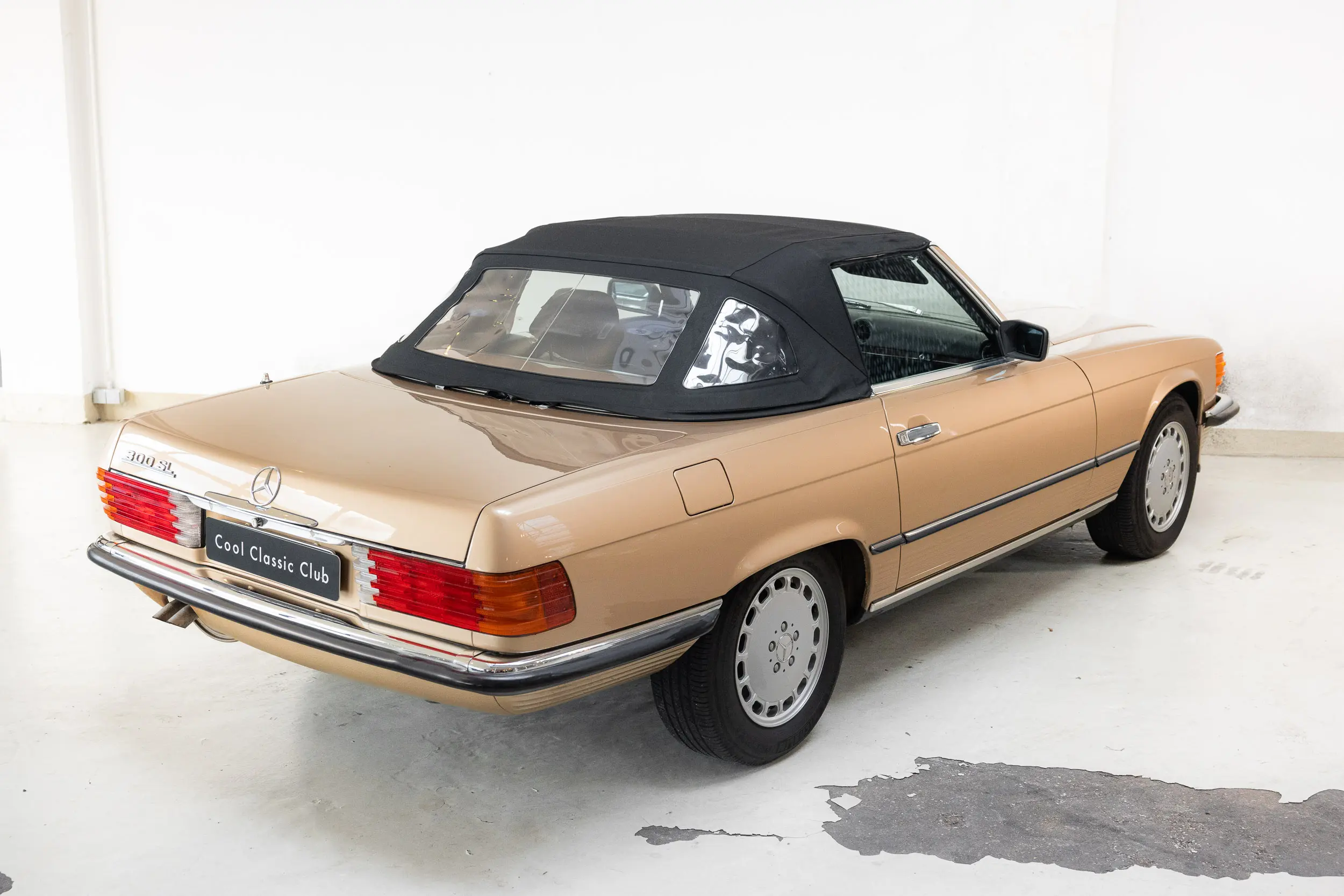 oblique rear view with roof up of an Mercedes-benz 300 SL R107 1986