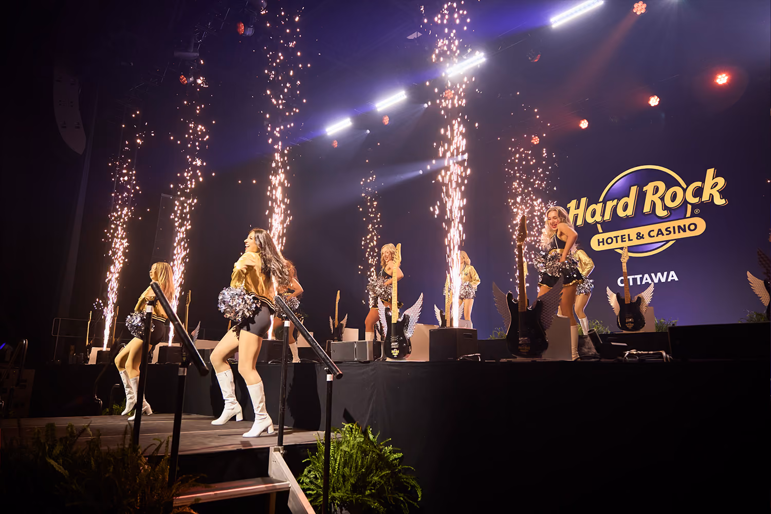 Cheerleaders performing while pyro goes off at Hard Rock Ottawa
