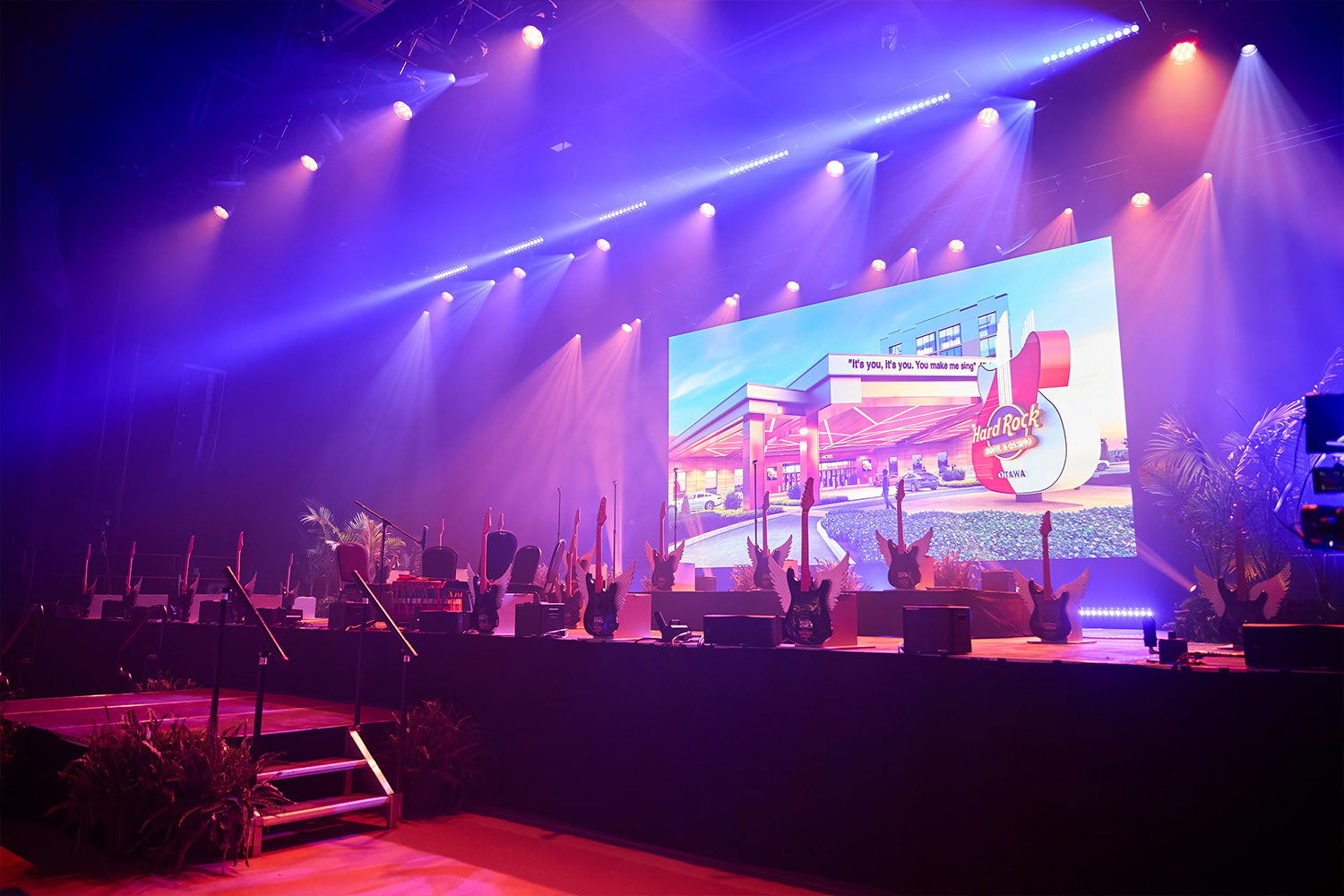 A stage with blue and pink lighting at Hard Rock Ottawa opening