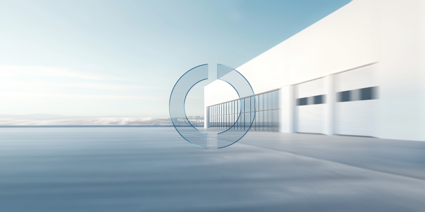 Eine moderne Industriehalle mit klaren Linien und großzügigen Glasflächen steht für effiziente Strukturen und zukunftsorientierte Lösungen bei EMPORIAS.