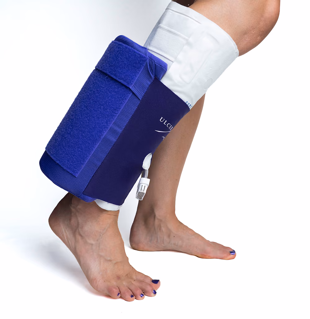 A patient walking in the Heel Keeper Ultra while wearing a Sequential Compression Device