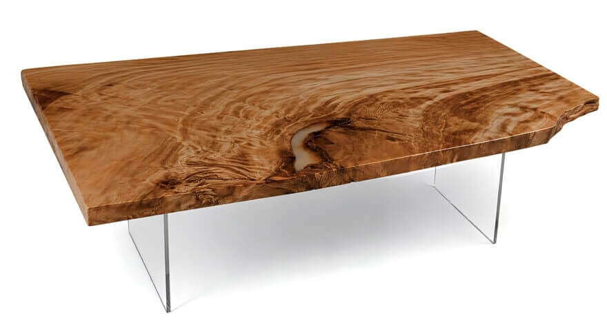 Ausgefallener Designtisch mit großer Tischplatte mit außergewöhnlichem Maserung mit eleganten Glasfüßen als exklusives Naturkunstwerk