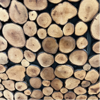Stacked logs at Happy Hive