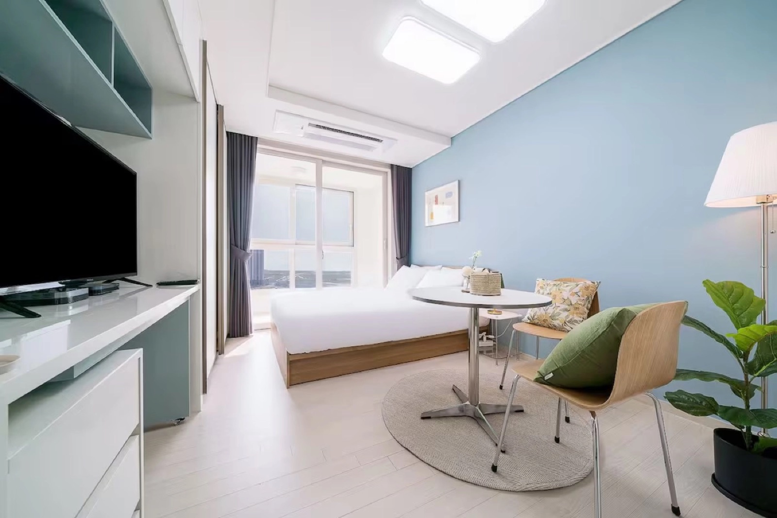 Bed and furnishings inside a Songdo residence bedroom