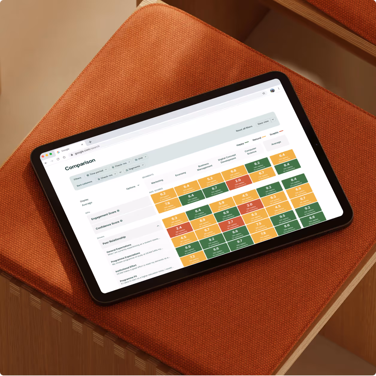 Hands typing on a MacBook Pro showing a web-based project checklist with tasks, dates, and status indicators.