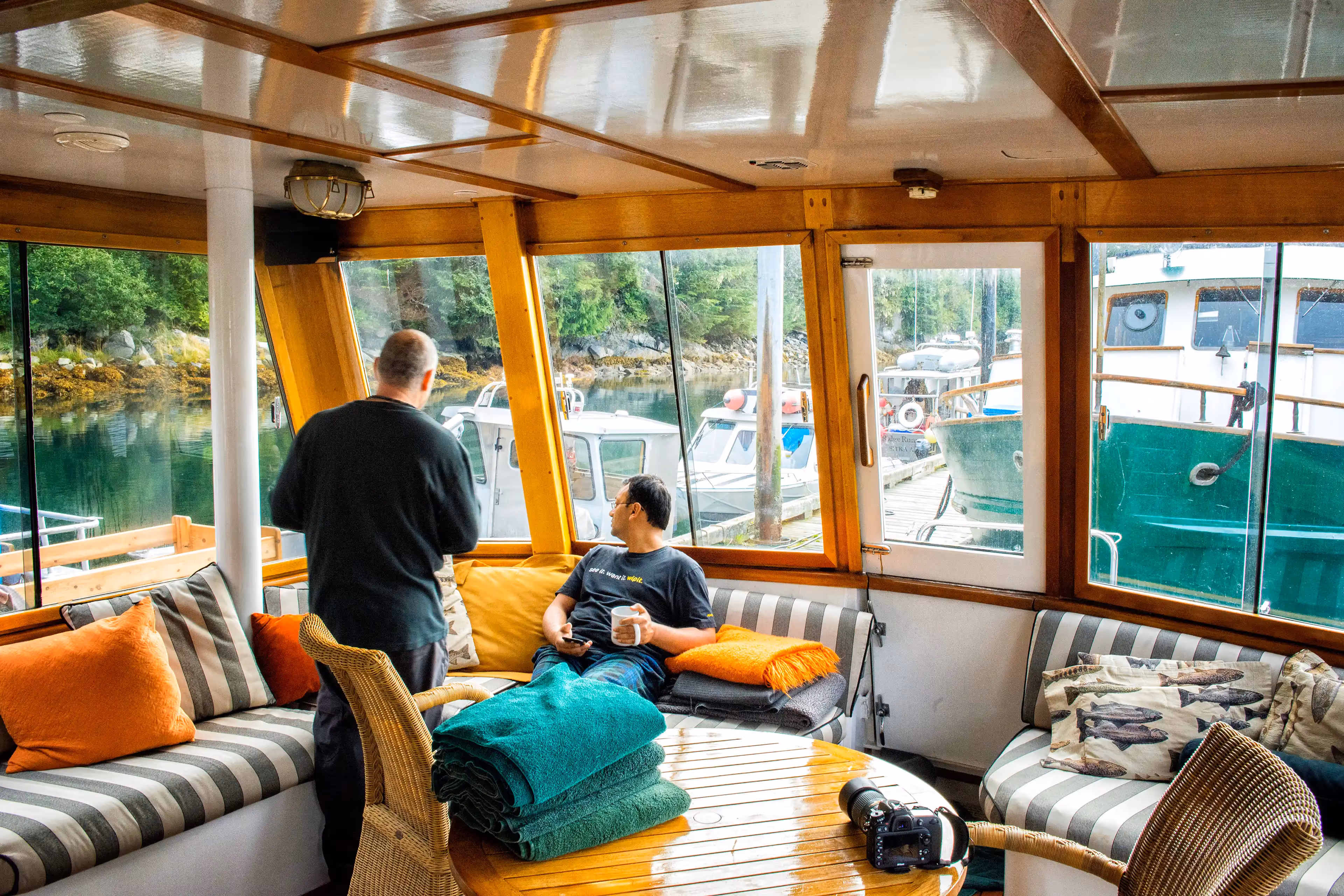 Happy guests enjoying their time on the yacht during an Alaska adventure.