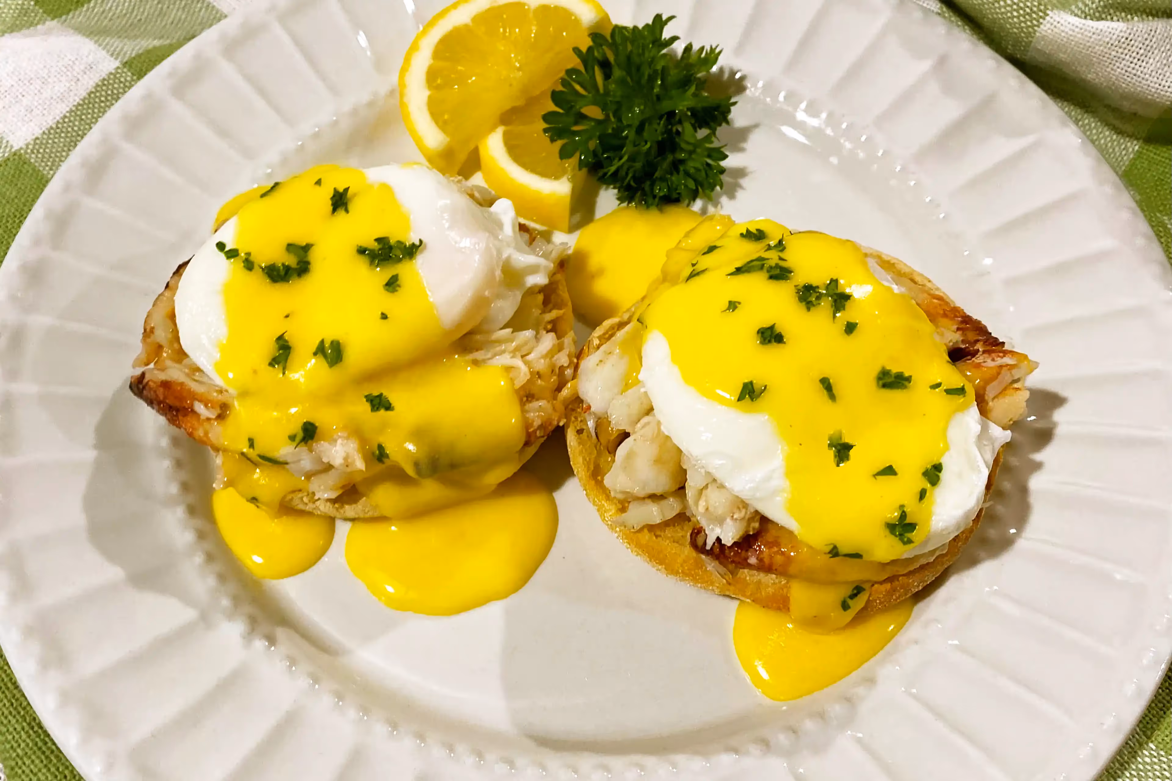 Delight in our Dungeness Crab Benedict, a gourmet breakfast featuring succulent crab atop perfectly poached eggs drizzled with a luscious hollandaise.