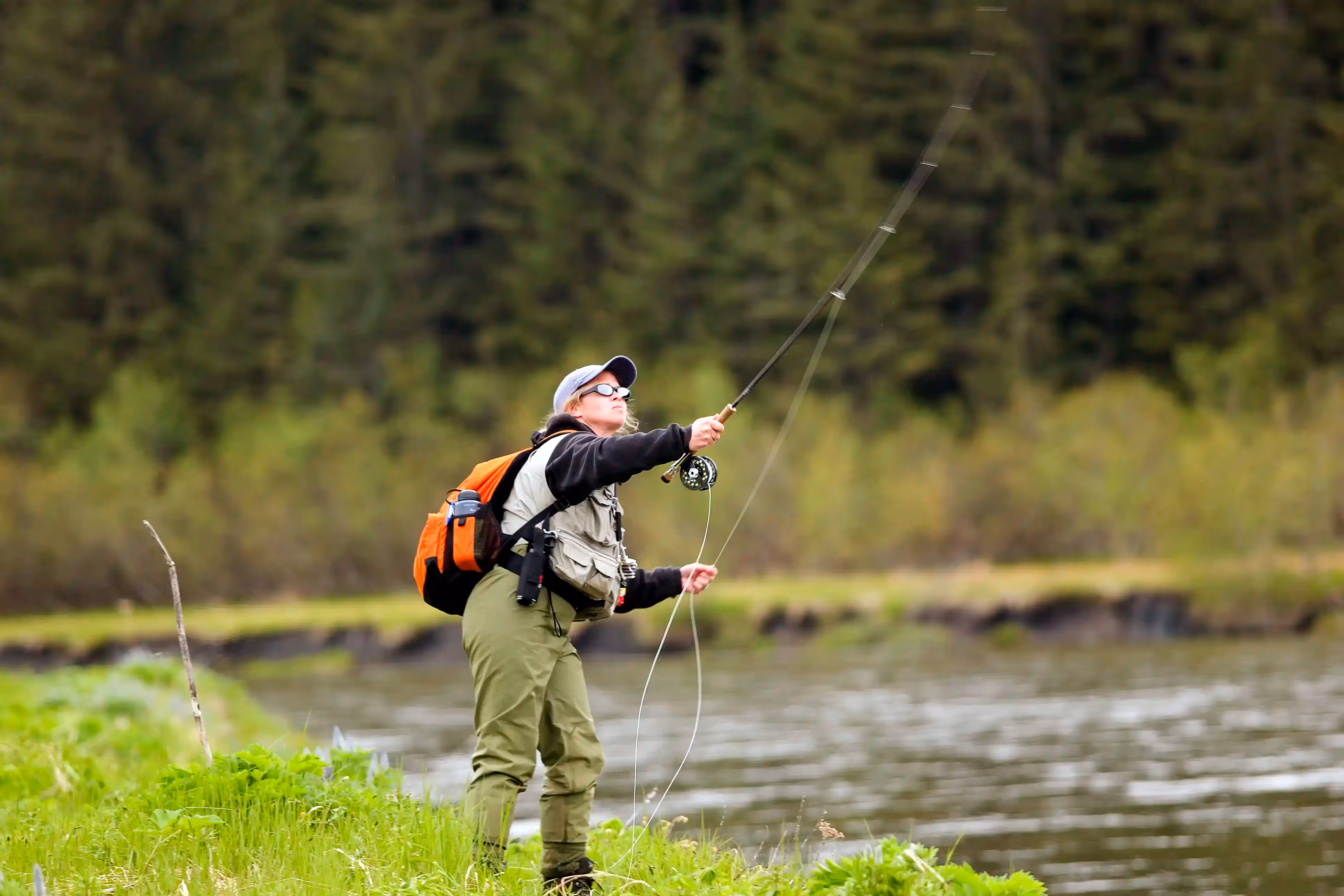 Woman fly fishing