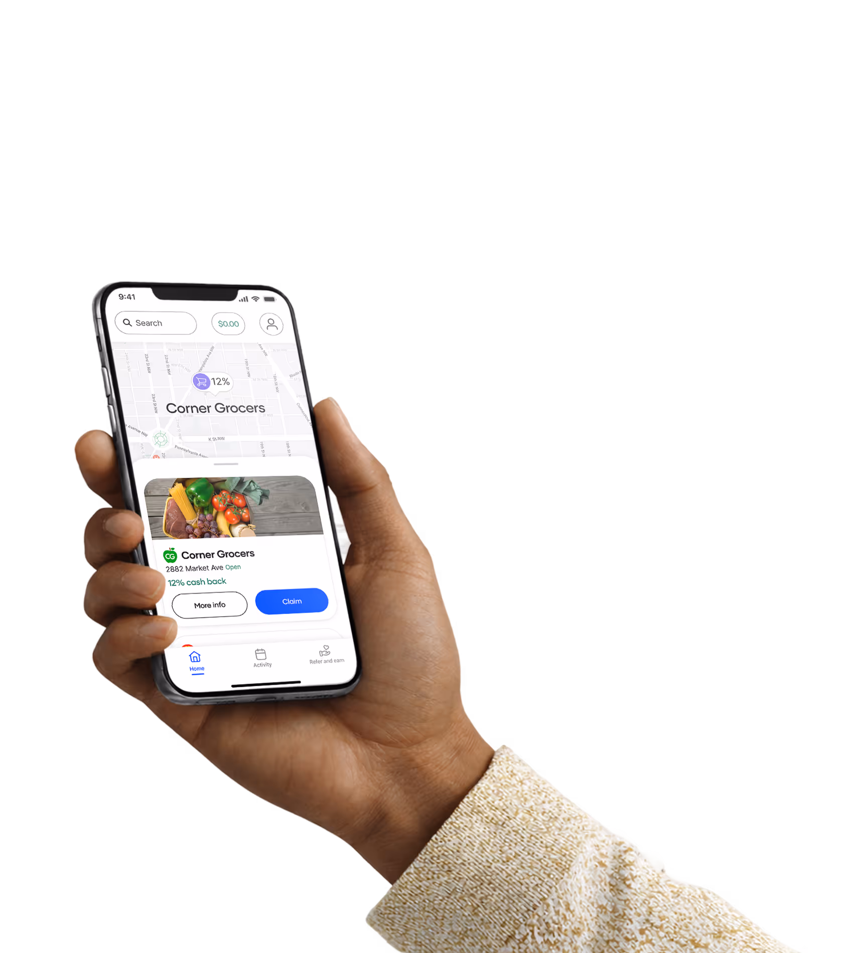A person holds a smartphone displaying a shopping rewards app with a map and a listing for "Corner Market" offering "12% cash back" at "123 45th St, New City, NY Open". The screen shows buttons labeled "More info" and "Claim" along with navigation icons for "Home", "Activity", and "Refer and earn".