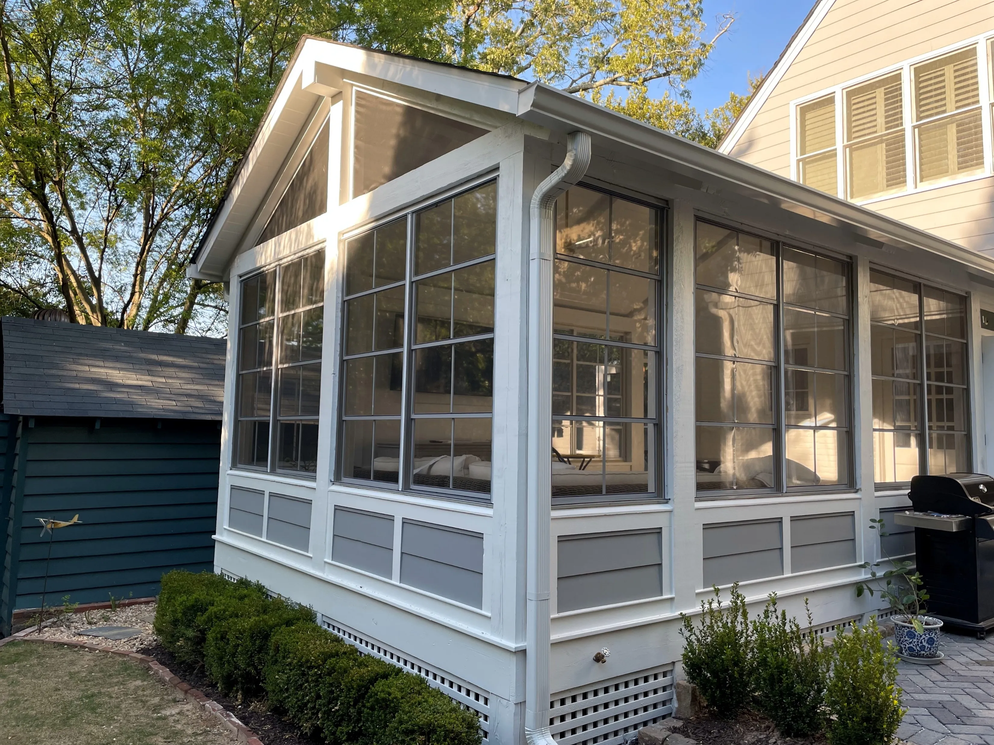 A custom glass window sunroom addition built in a brick based home in North Georgia