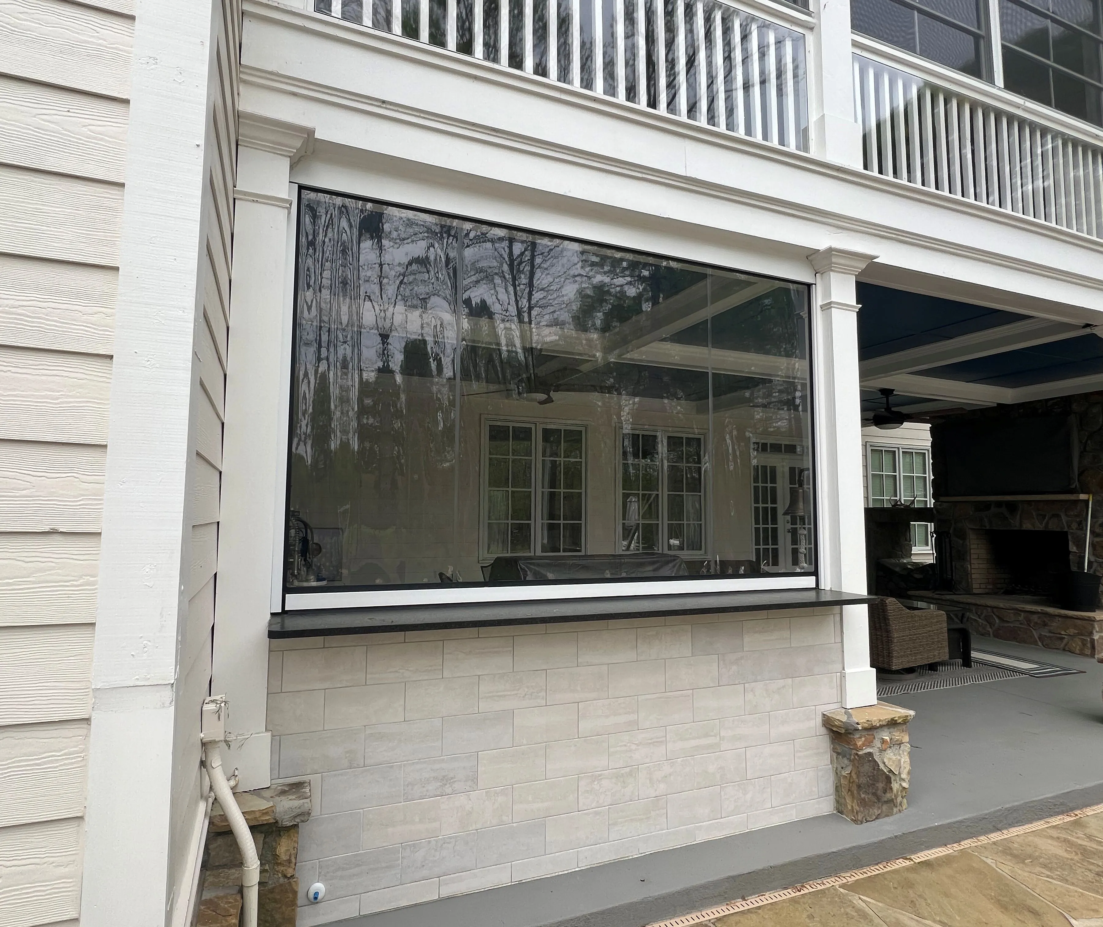 A custom glass window sunroom addition built in a brick based home in North Georgia