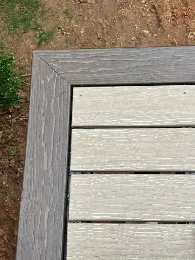 A custom deck addition made of wood built on the back of a North Georgia home in the woods