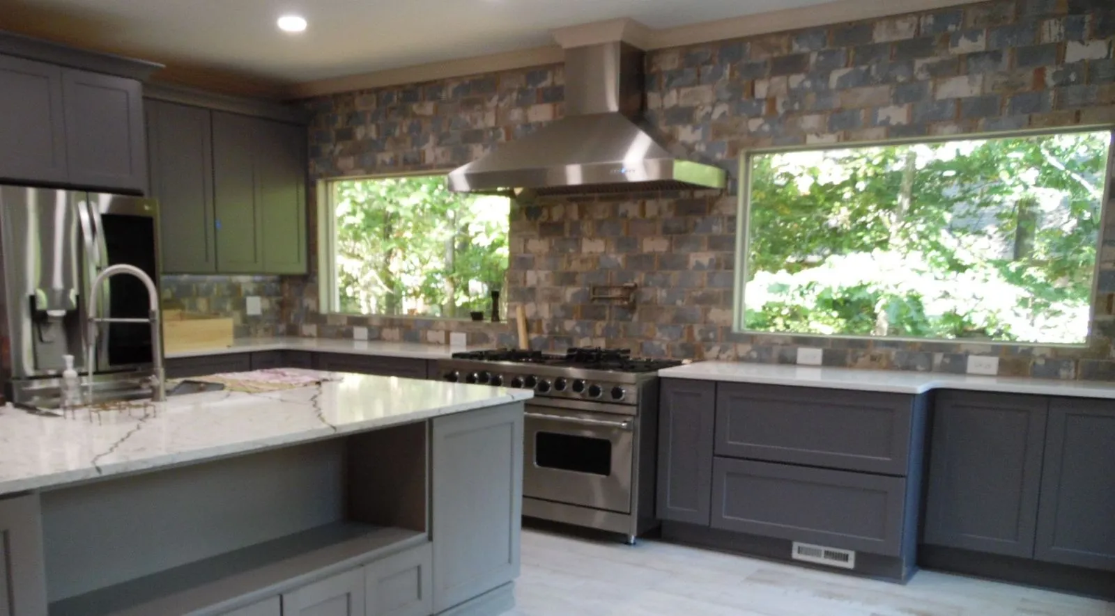 A spacious and well-lit custom deck addition built on the back of a luxurious home in North Georgia