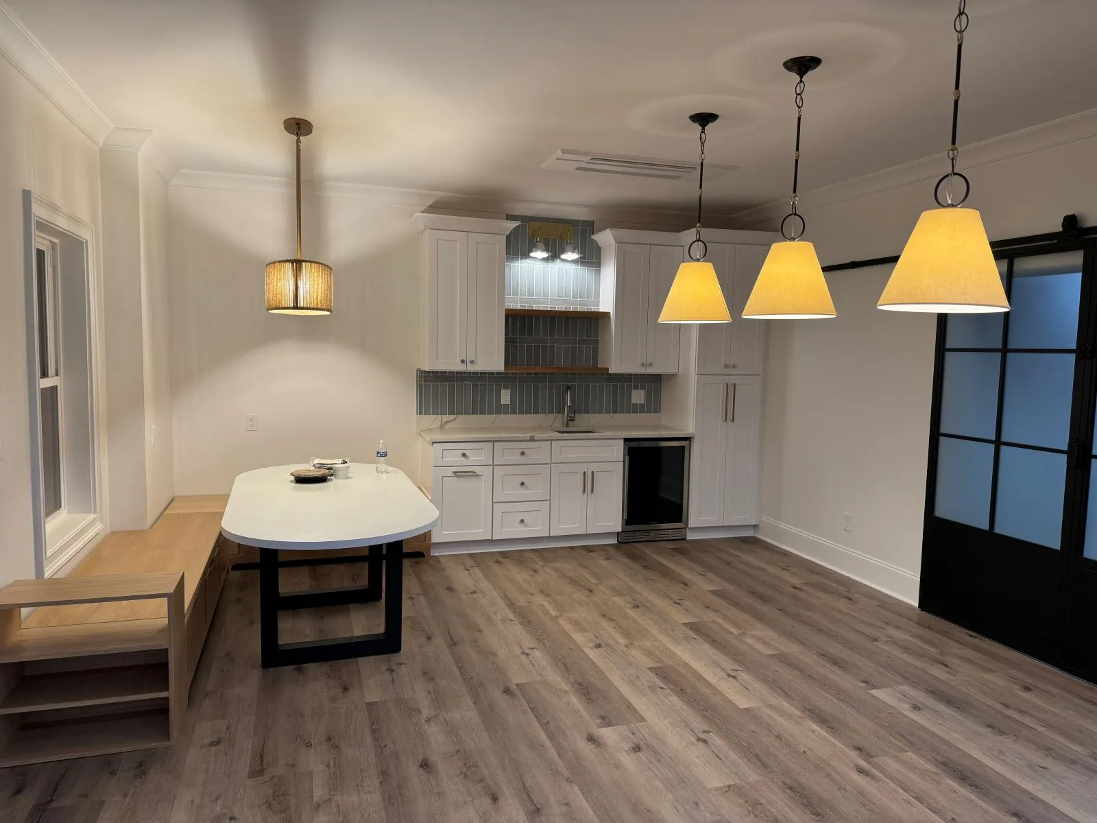 A spacious and well-lit custom deck addition built on the back of a luxurious home in North Georgia