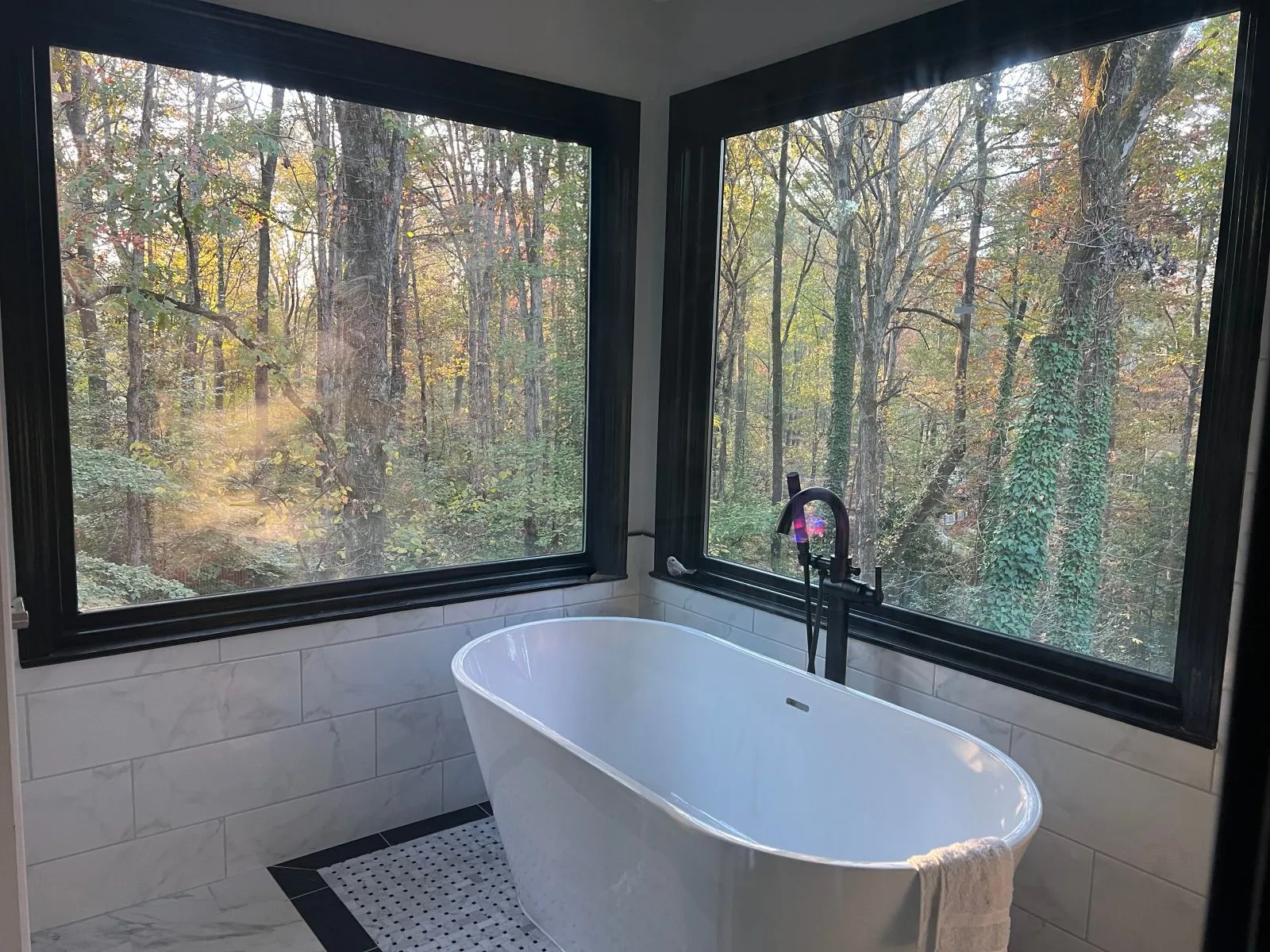 A spacious and well-lit custom deck addition built on the back of a luxurious home in North Georgia