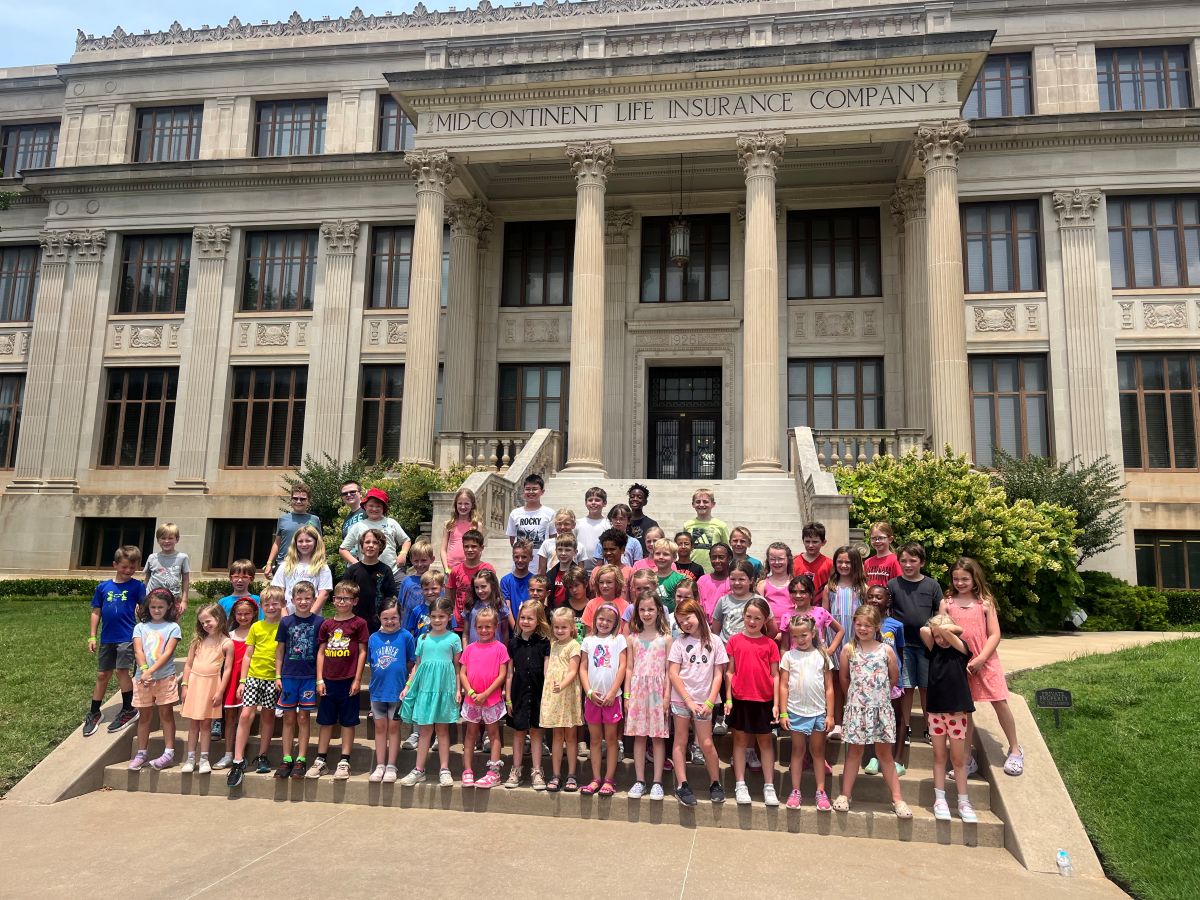Group of children posing on steps outside the Oklahoma Hall of Fame.