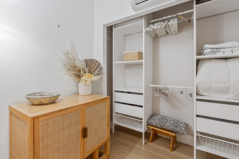 Modern bedroom with a wooden bed frame and a white mattress, no people