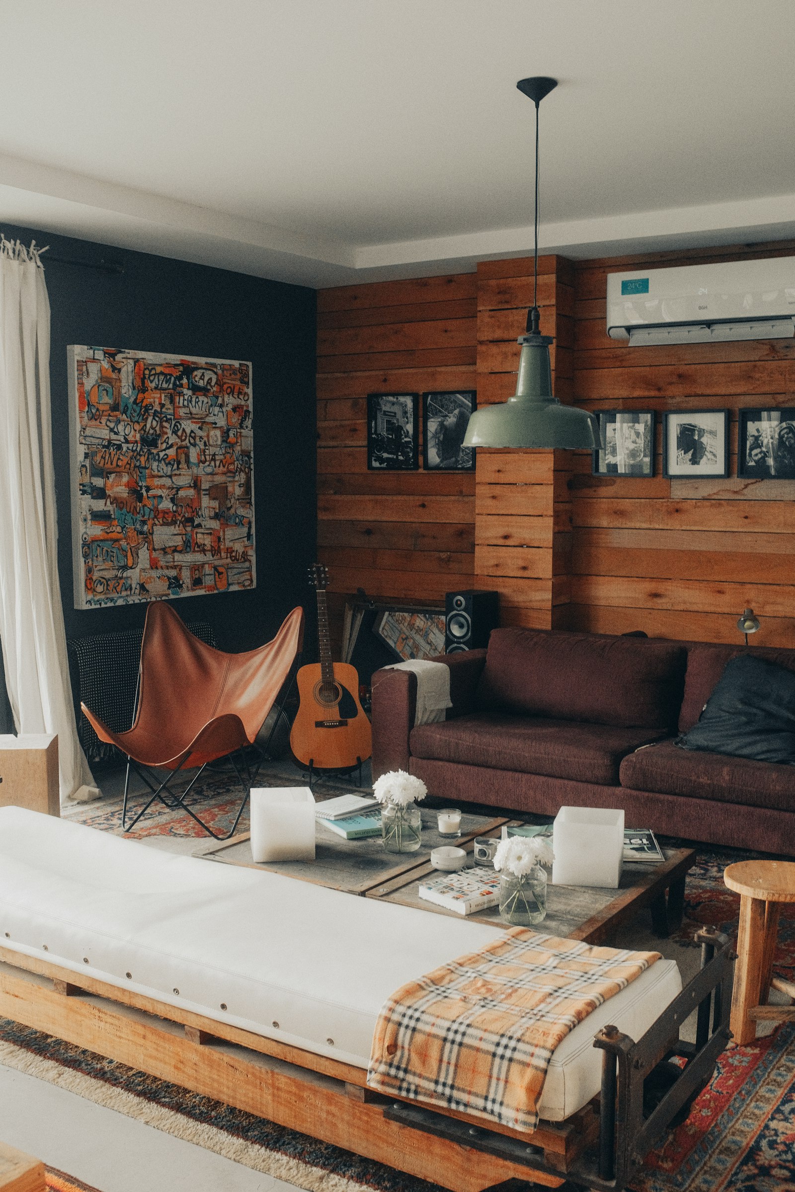 A warm, bright modern living room with a sofa kept cool and comfortable