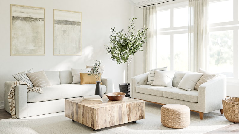 A bright, modern living room with a large window letting in natural light
