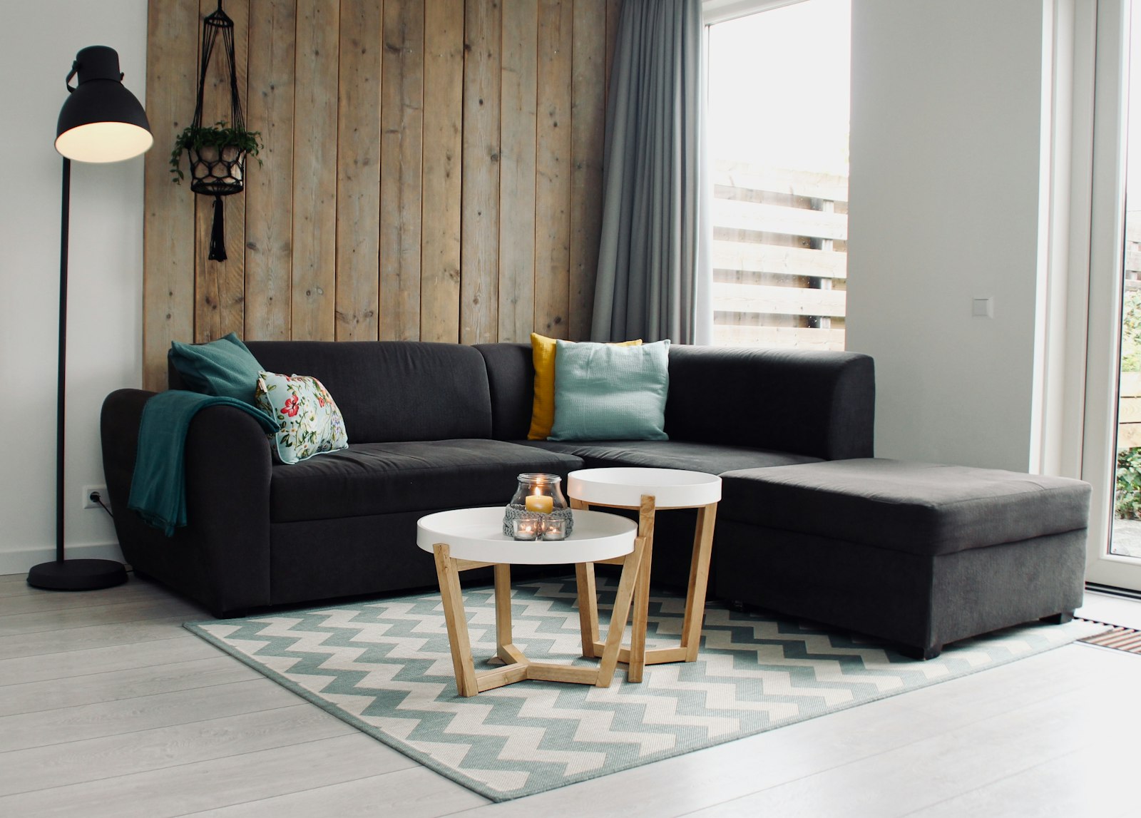 A warm, welcoming living room with a sofa and tidy coffee table ready for guests