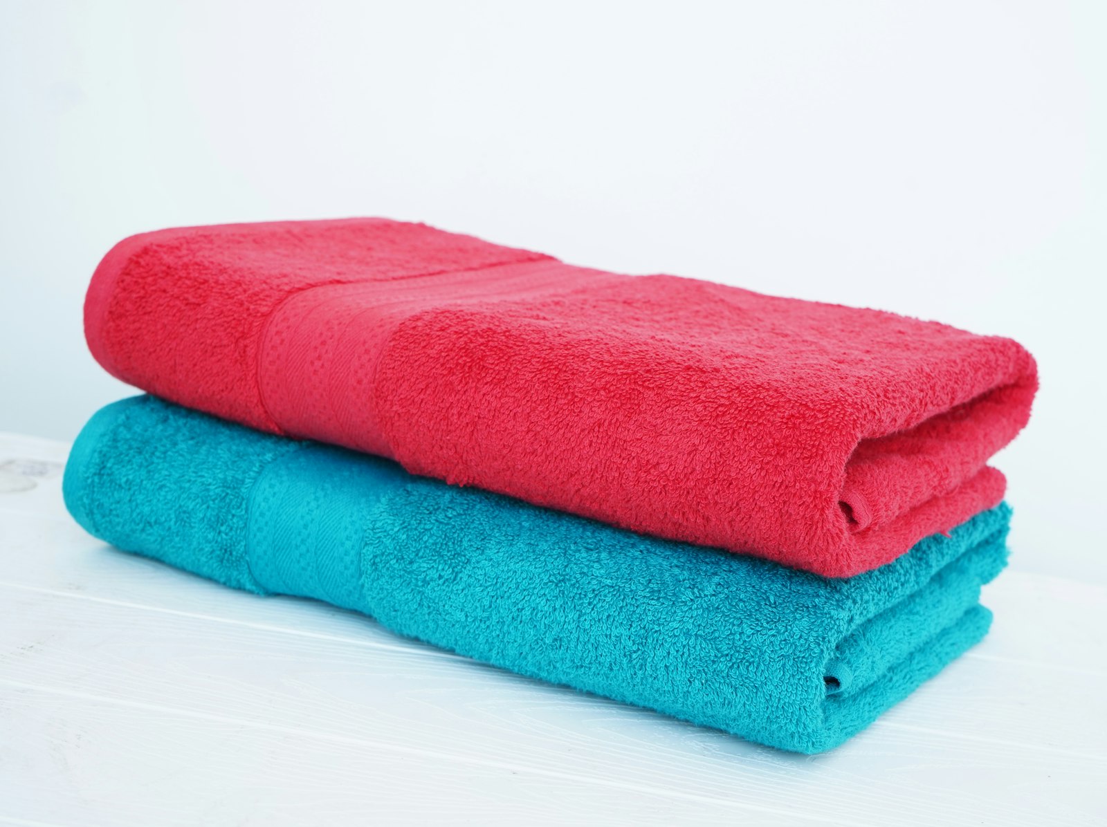 A neat stack of clean folded towels ready for guests