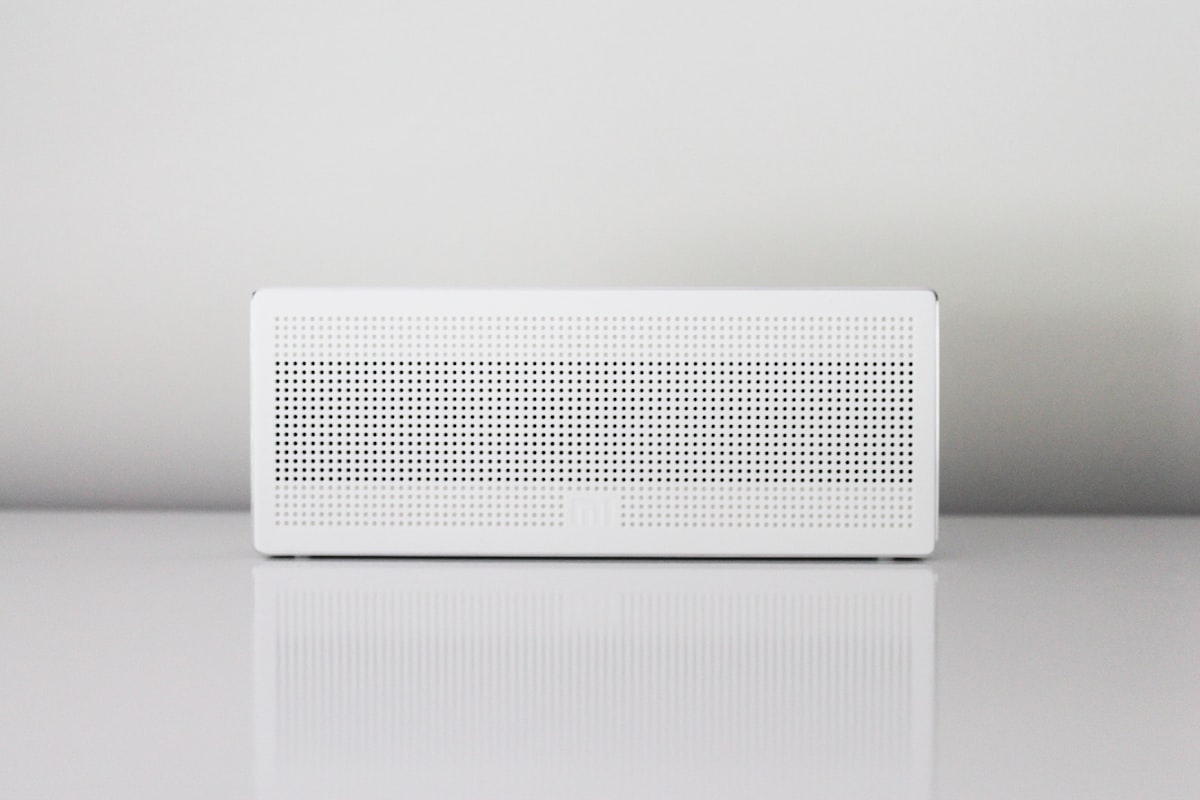 A white air purifier running in a home to help keep indoor air fresh