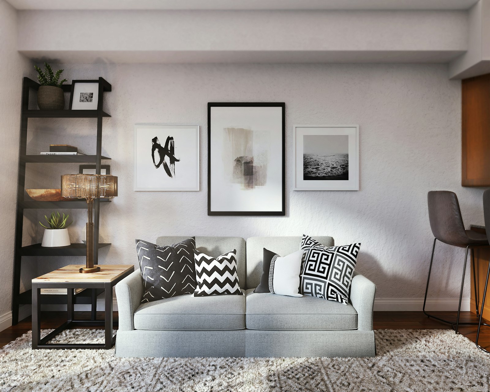 Pale fabric sofa with patterned cushions standing on a textured rug in a bright living room