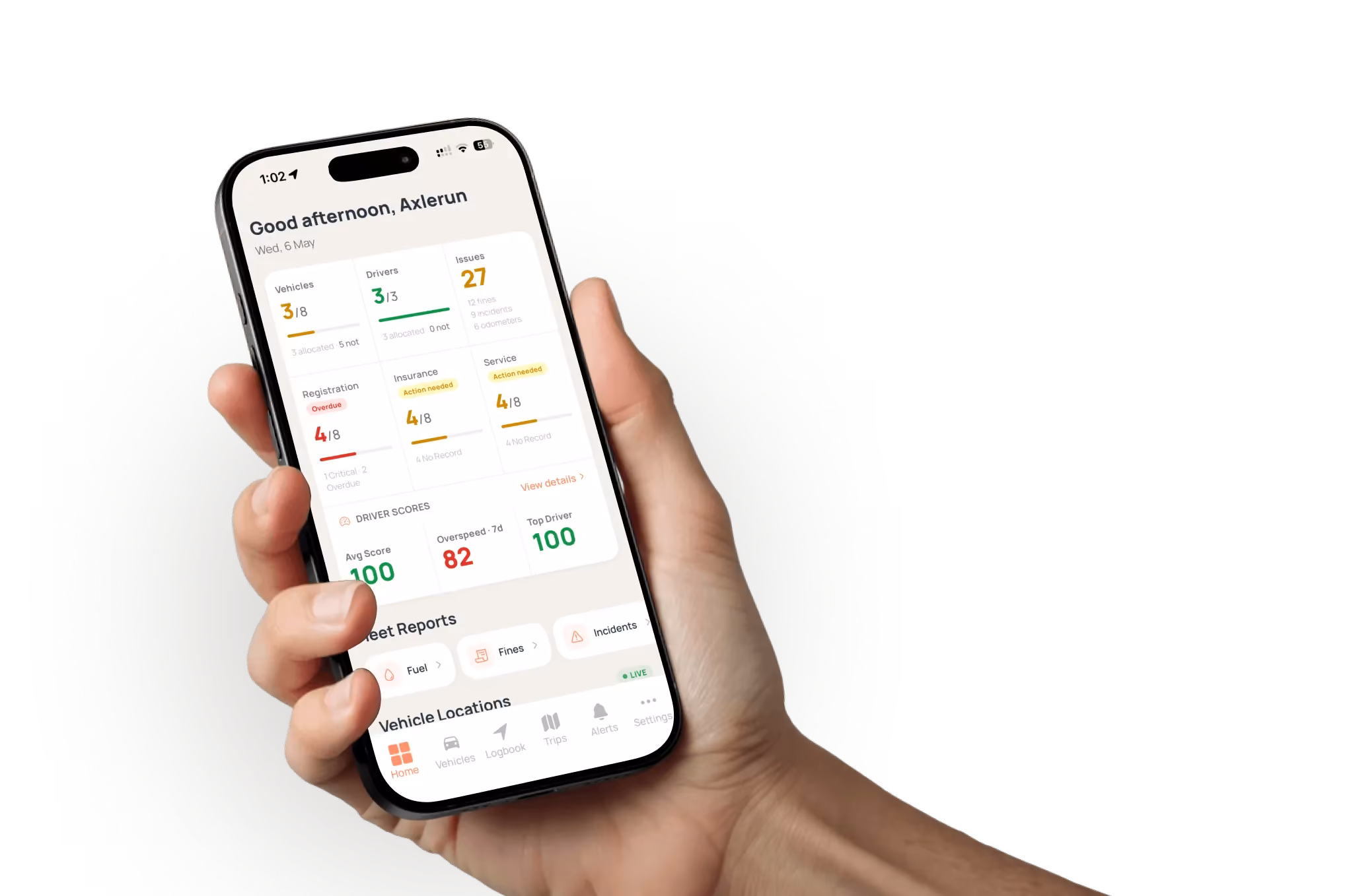 Hand holding a phone showing the Axlerun fleet dashboard with vehicle, driver and compliance counts