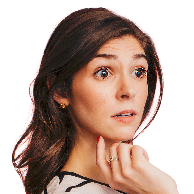 Close-up of a woman with dark wavy hair looking surprised, resting her chin on her hand.