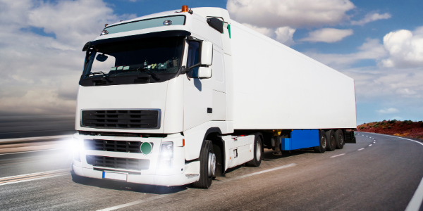 A white commercial truck, a heavy-duty vehicle.