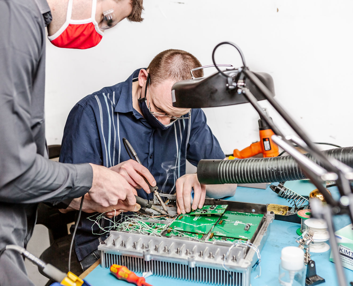 Two engineers working together on Exro Coil Driver technology.