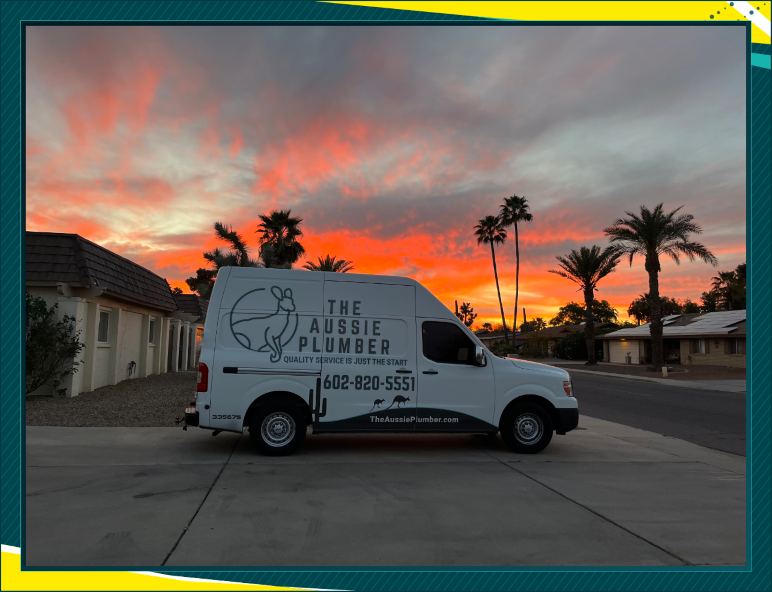 An early white The Aussie Plumber service van with kangaroo branding beneath a sunset.