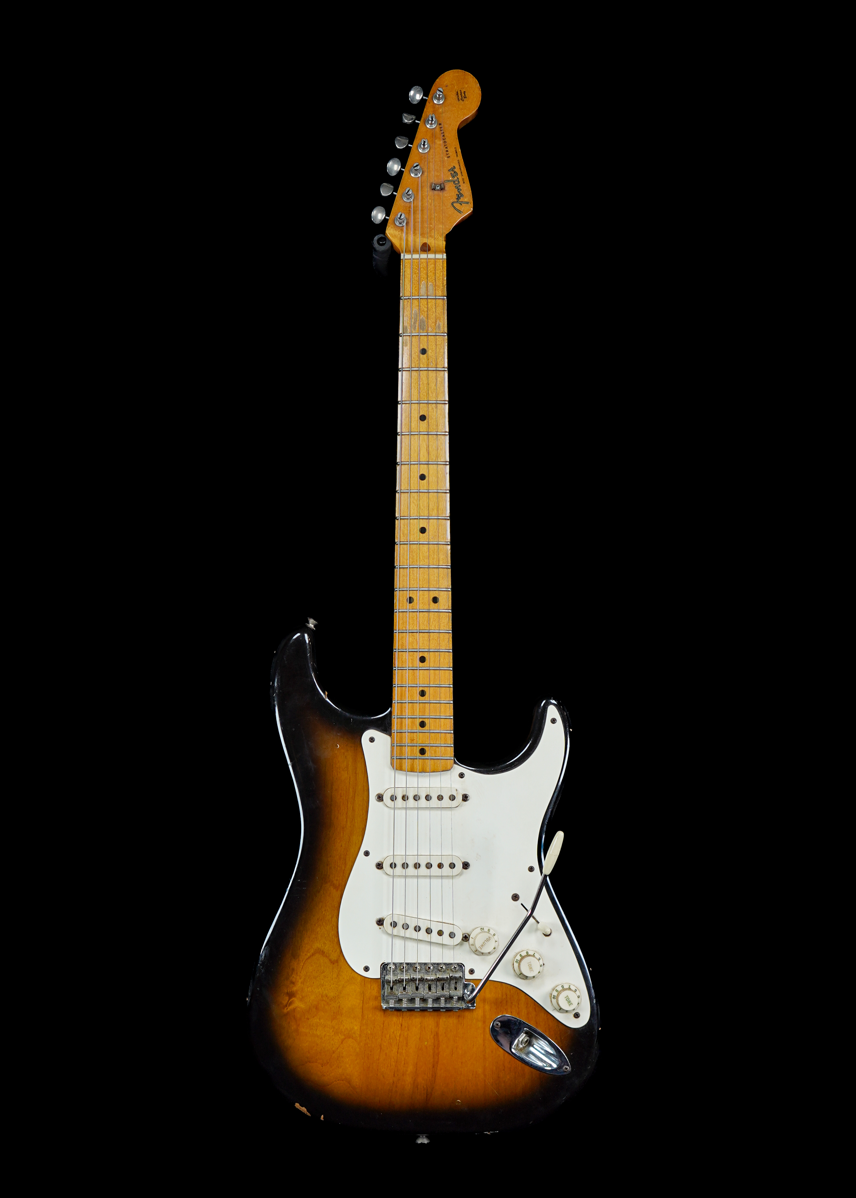 a professional photo of a 1982 Fender Fullerton American Vintage 57 Stratocaster Sunburst guitar by Tone Brothers