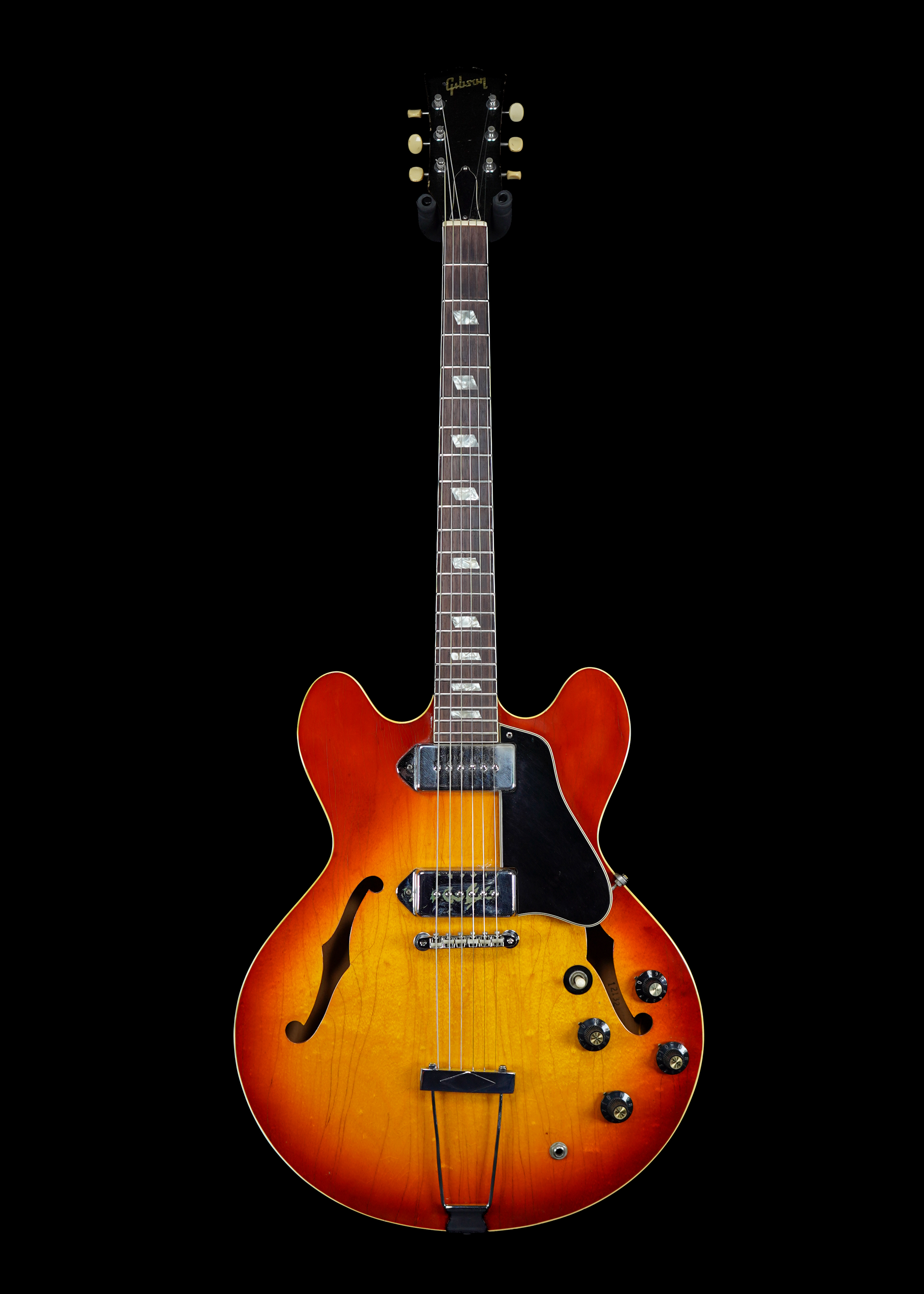 a professional photo of a 1969 Gibson ES-330 Sunburst guitar by Tone Brothers