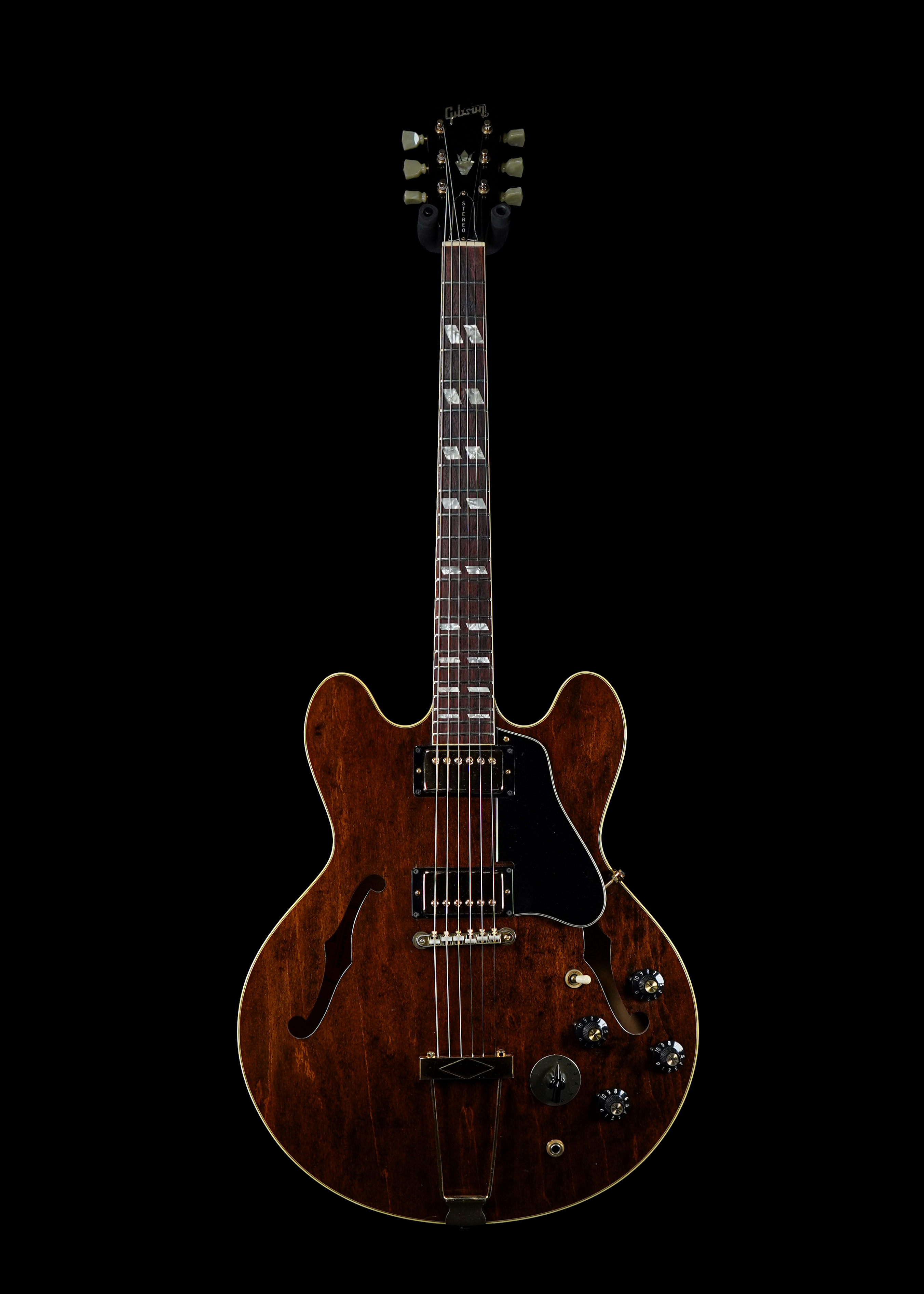 a professional photo of a 1969 Gibson ES-345 Walnut by Tone Brothers, the best place to sell my vintage guitar