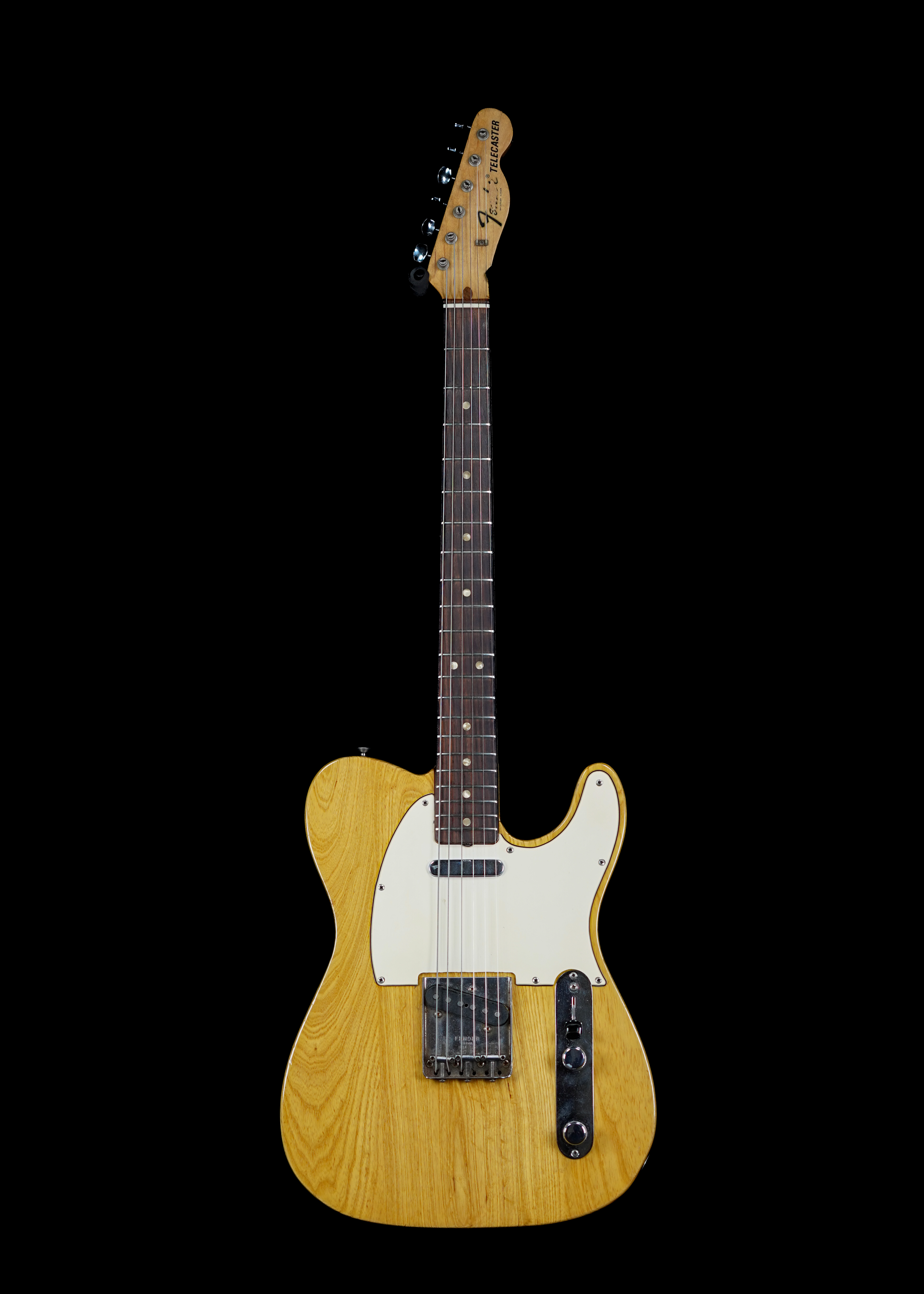 a professional photo of a 1969 Fender Telecaster Natural by Tone Brothers, the best place to sell my vintage Fender Telecaster