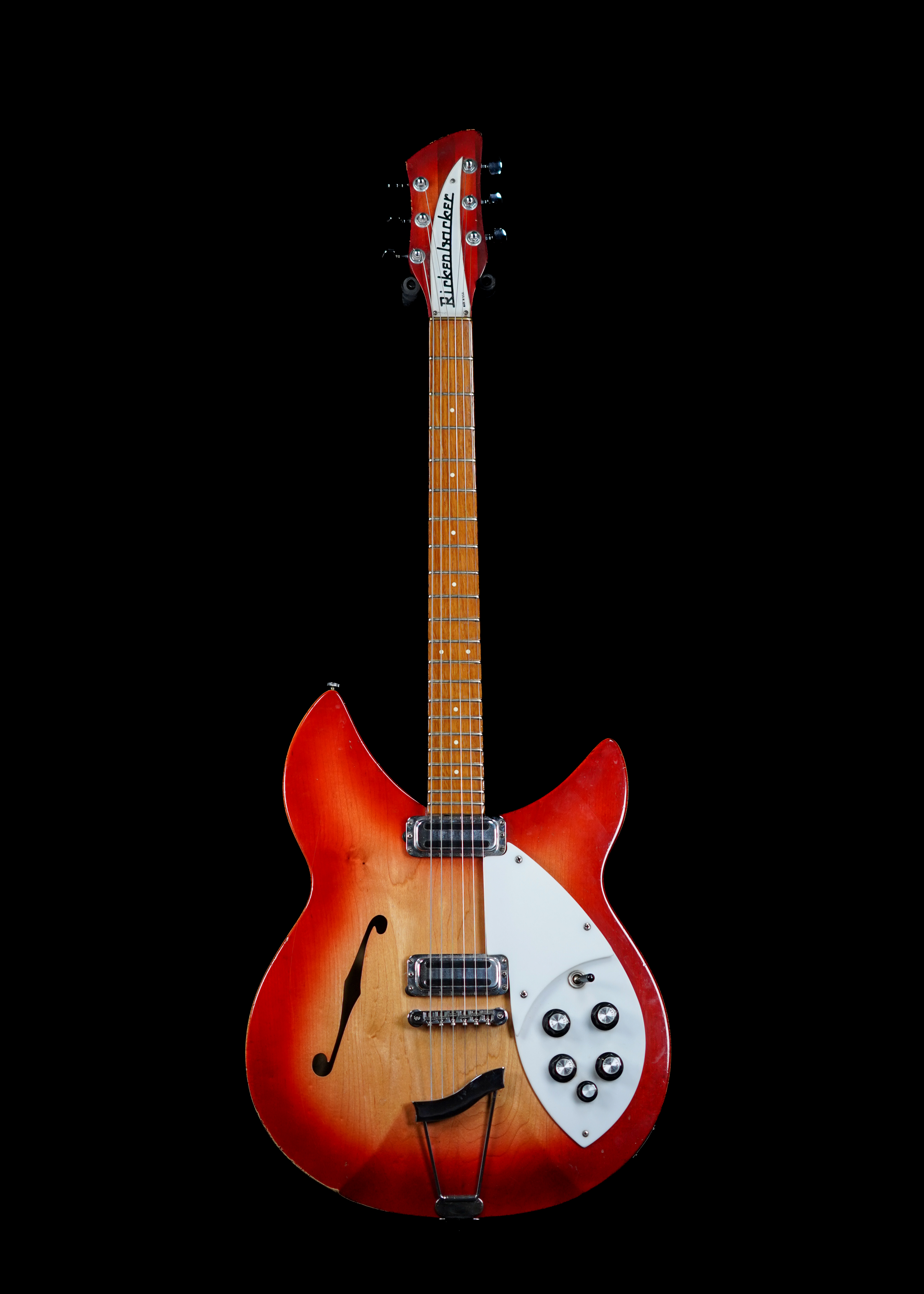 a professional photo of a 1967 Rickenbacker 330S Fireglo by Tone Brothers, the best place to sell my vintage Rickenbacker guitar