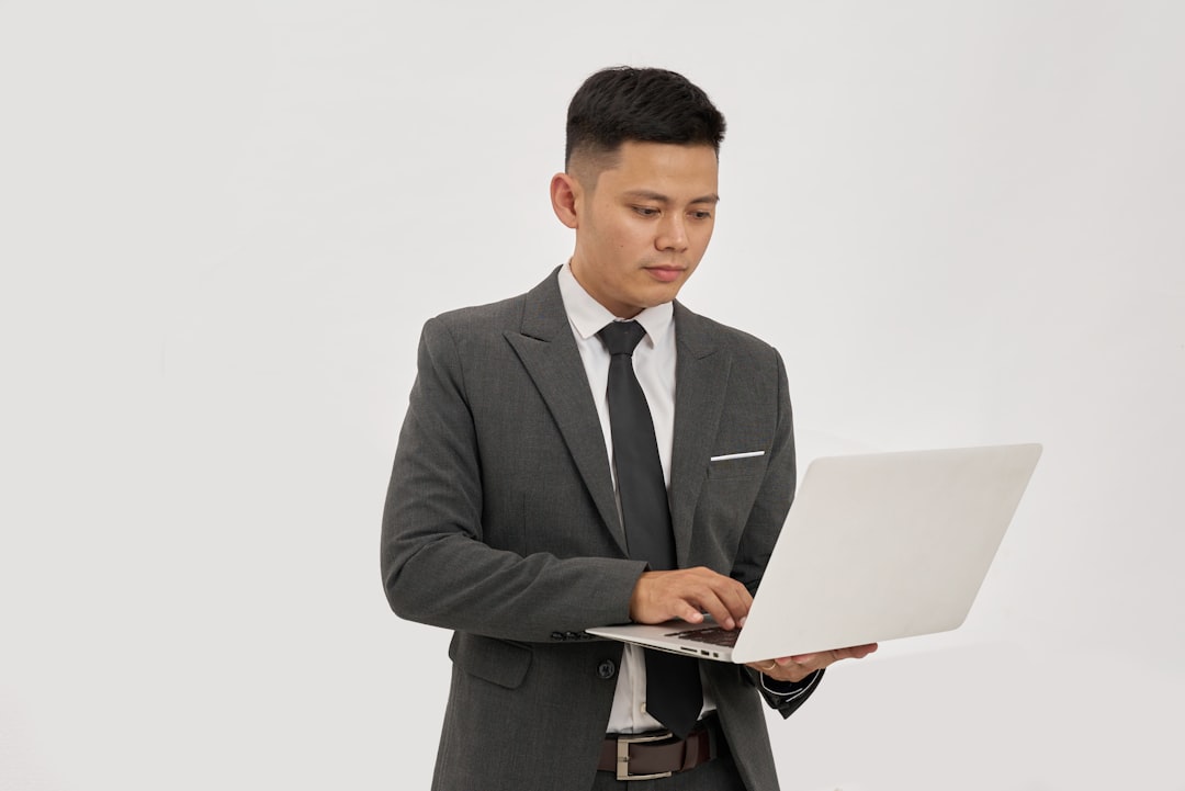 asian business laptop whatsapp scan — Photo by TRAN NHU TUAN on Unsplash