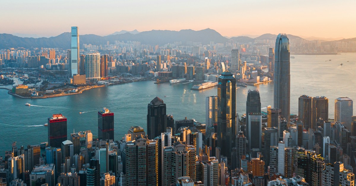 Hong Kong Central skyline at sunrise, home of the city's licensed money lenders and finance firms - Photo by Manson on Unsplash